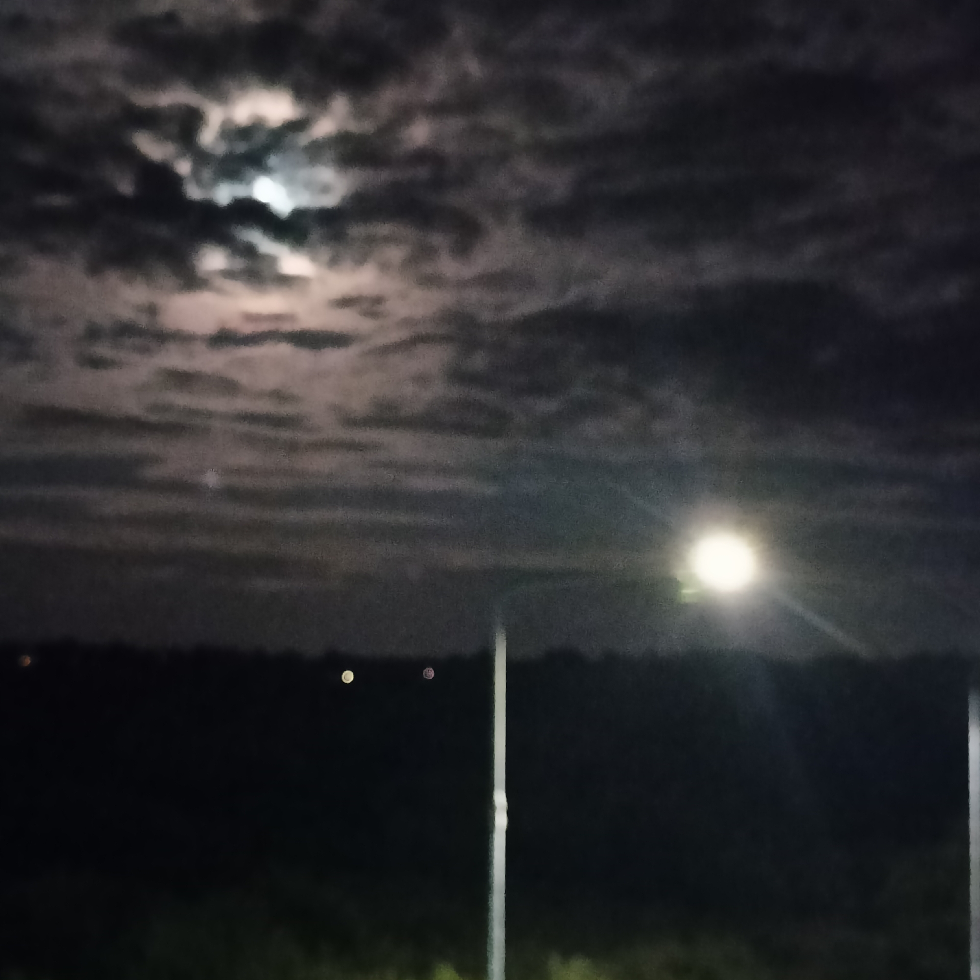 Full moon over Limerick's nighttime roads, late July