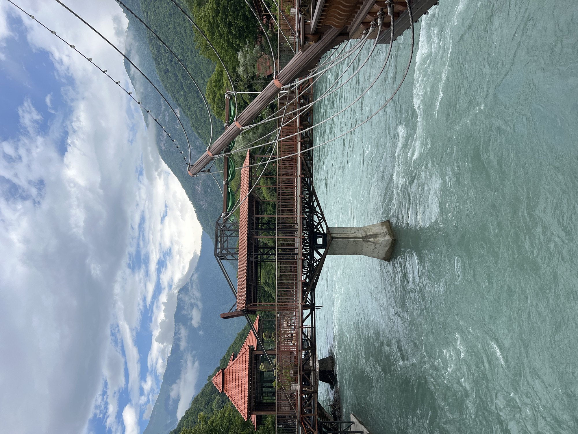 Elaborate riverside restaurant complex on a turquoise mountain river in Abkhazia