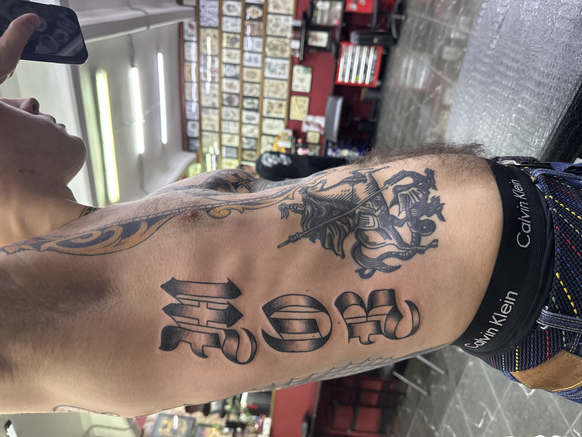 Elaborate tattoo artwork observed on individual's leg in Moscow