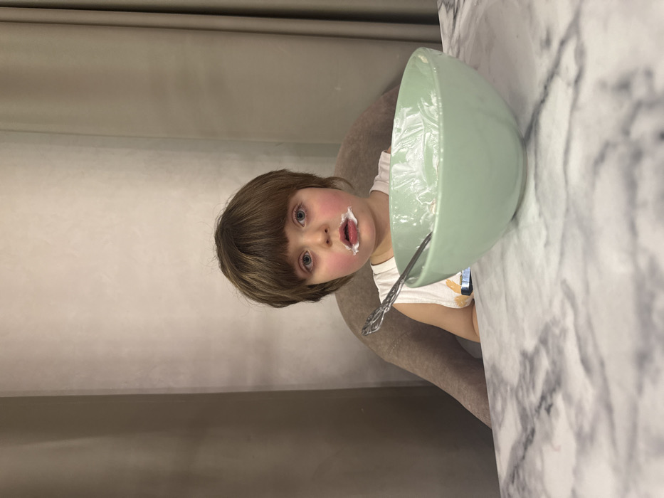 Child enjoys messy cereal meal in Khimki
