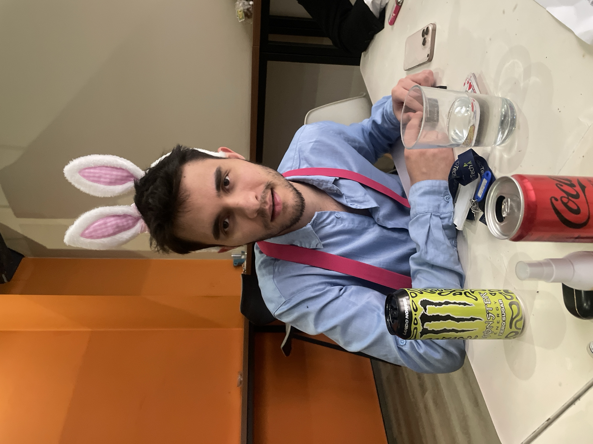 Man in bunny ears and pink suspenders photographed in Sofia