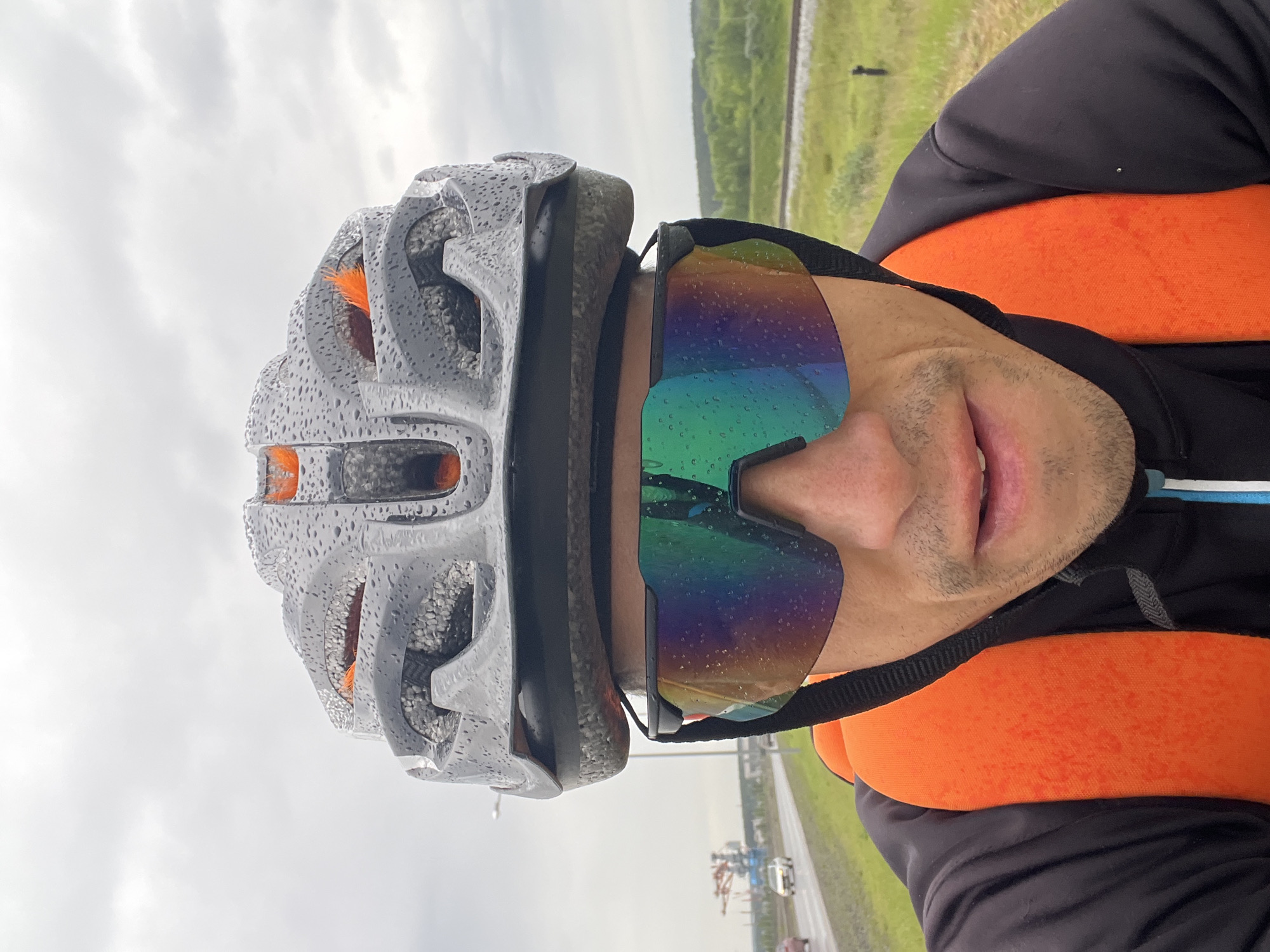 Cyclist photographed in rainy conditions in Chaikovsky, Russia