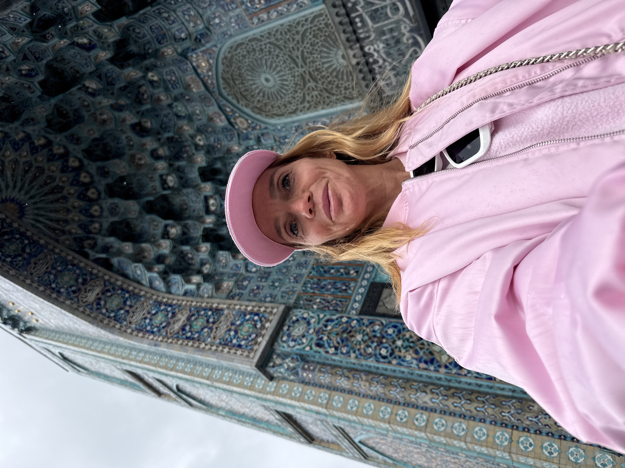 Tourist visits Saint Petersburg Mosque during rainy May morning