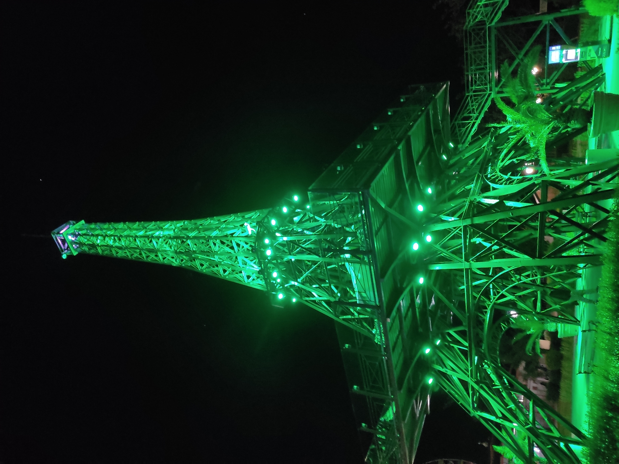 Illuminated Eiffel Tower replica observed at night attraction