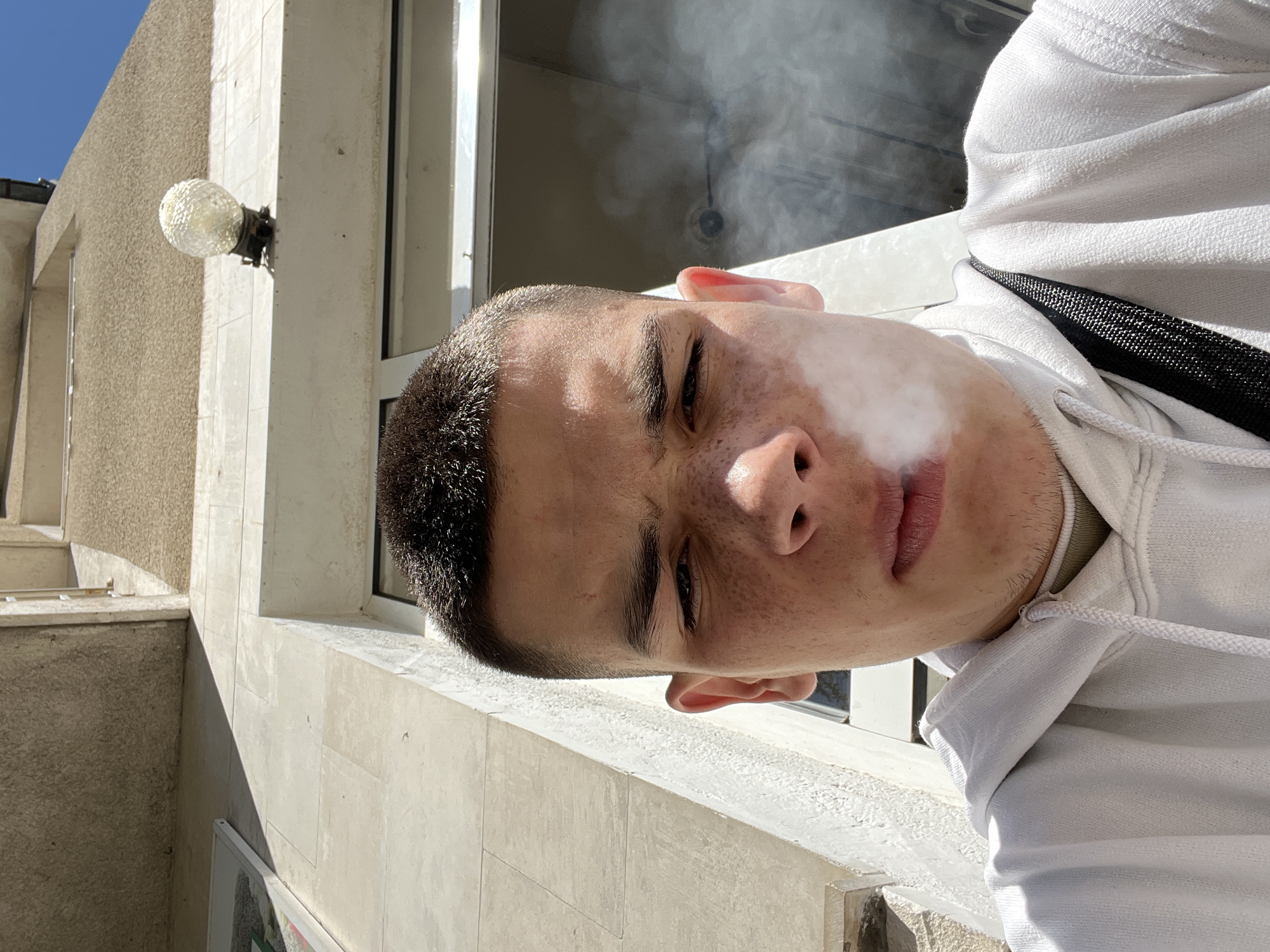 Young man smoking captured on Karlovo street