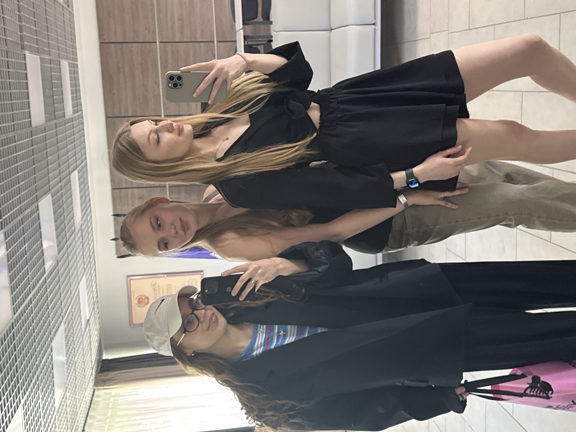Three women photographed taking selfies in Perm public space