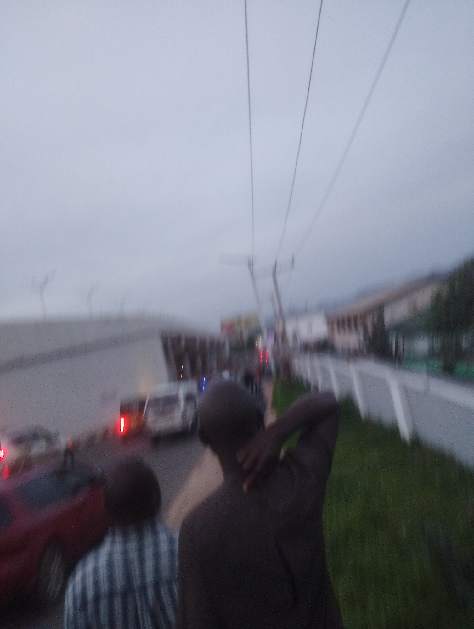 Evening street activity along a Jos road, Nigeria
