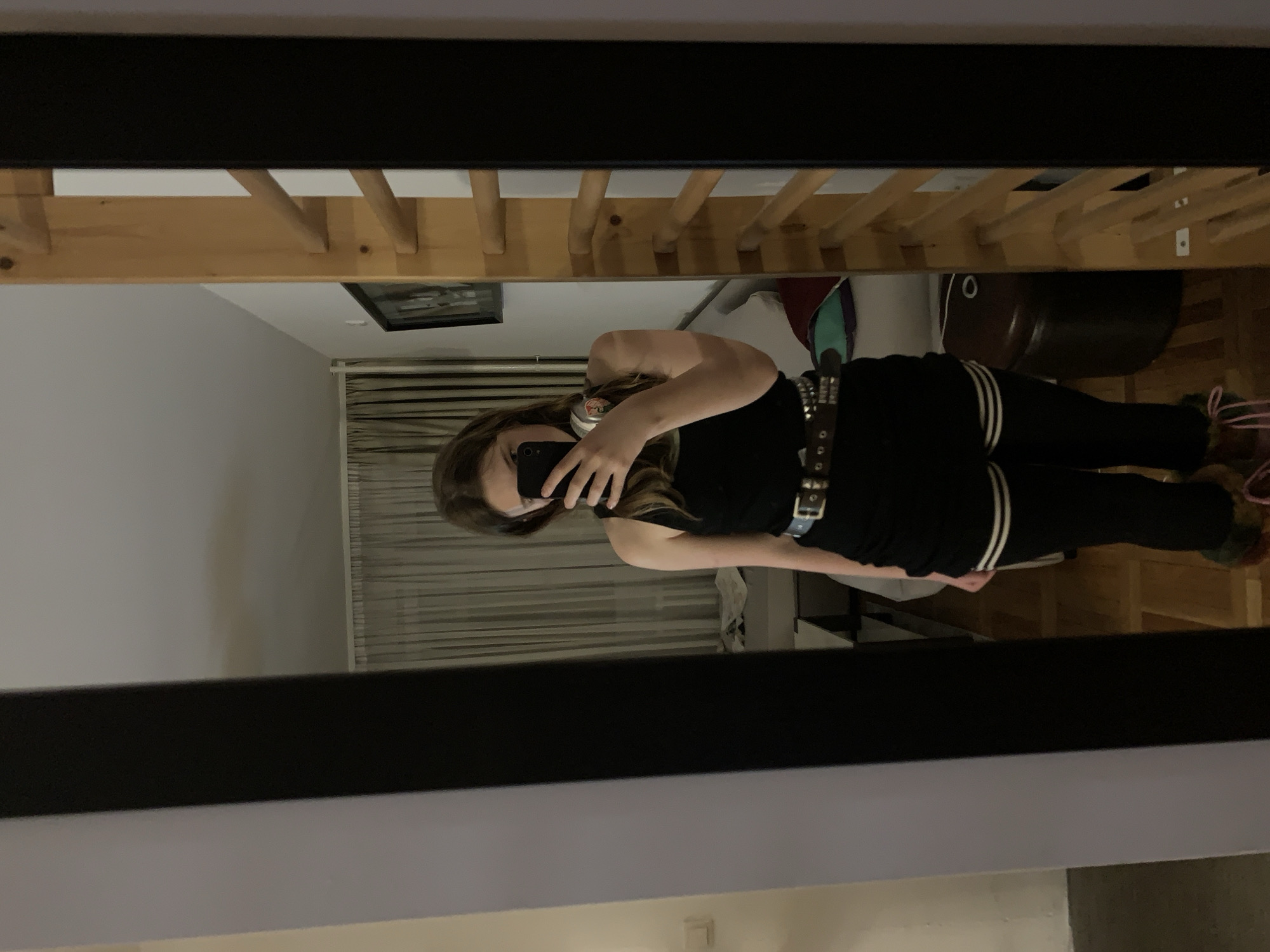 Woman takes mirror selfies in Belgrade bedroom