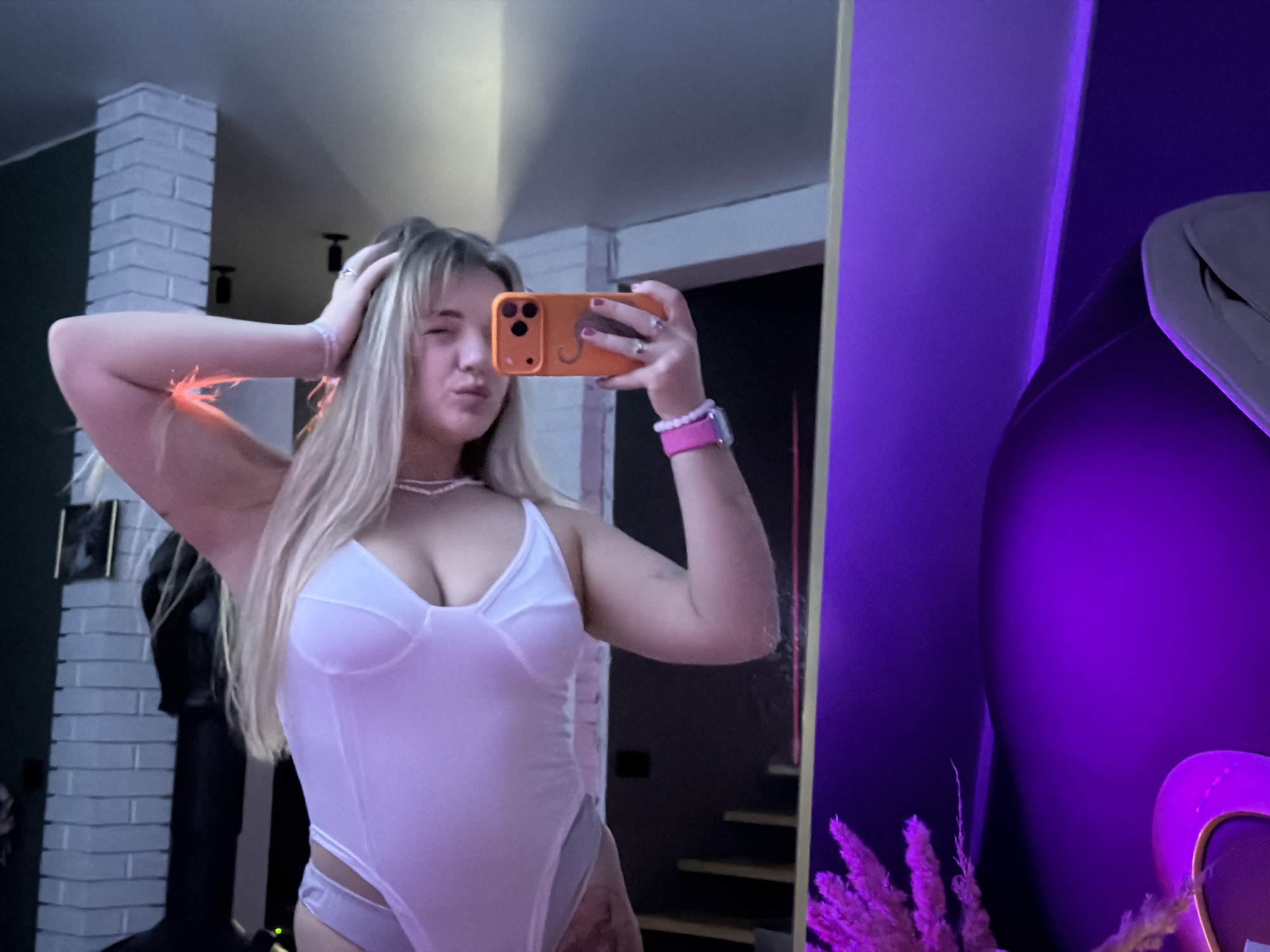 Woman takes multiple mirror selfies in Russian village home