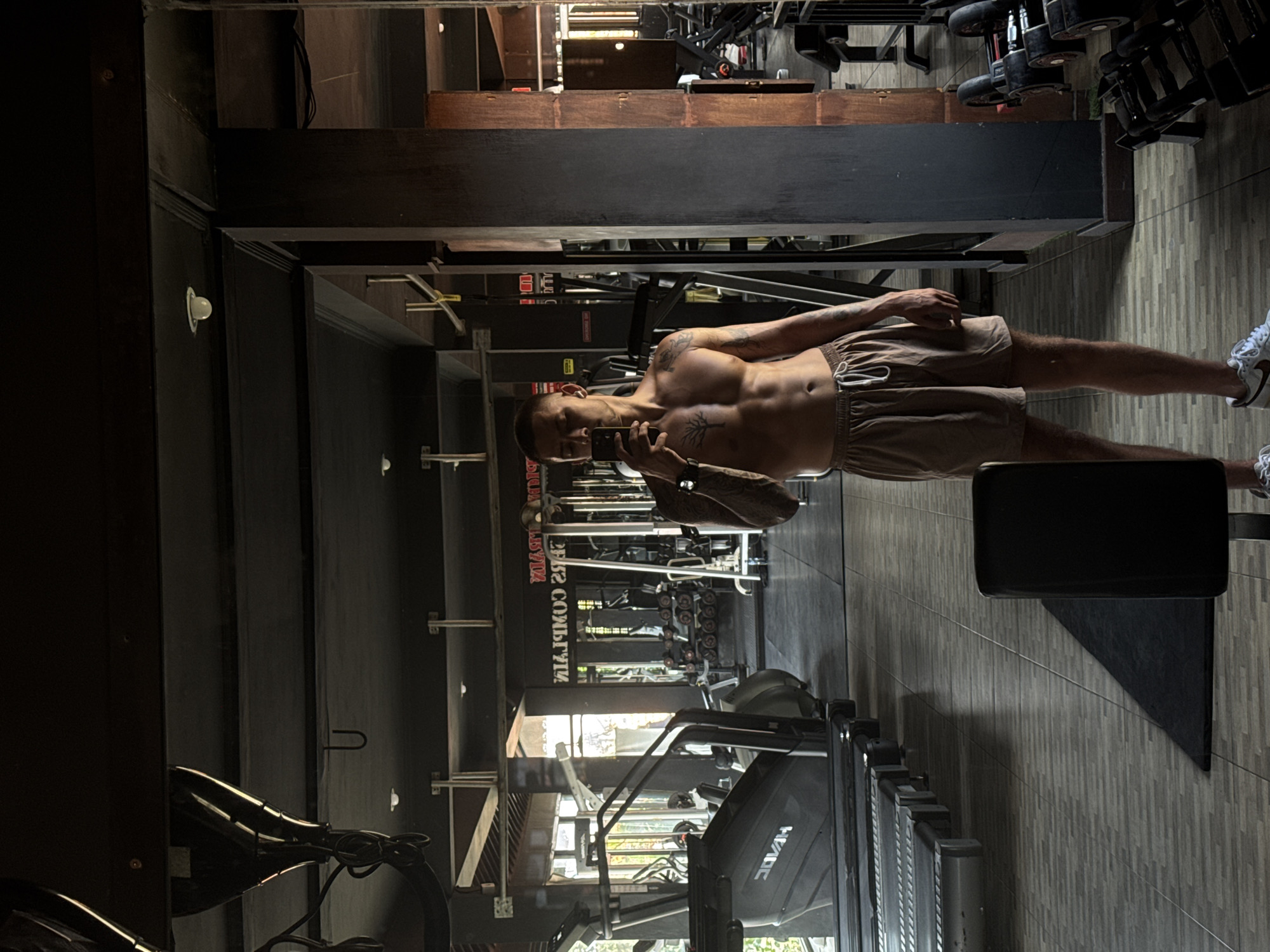 Man takes selfie at gym in Pererenan, Indonesia