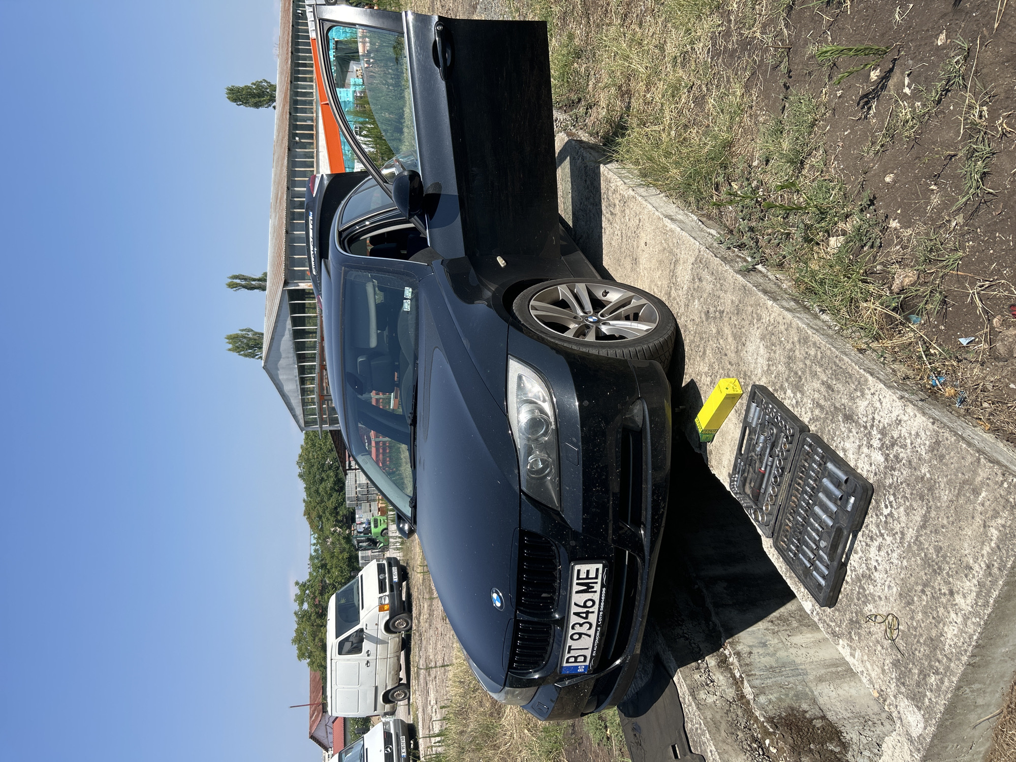 BMW gets serviced at an outdoor pit stop in Dimitrovgrad
