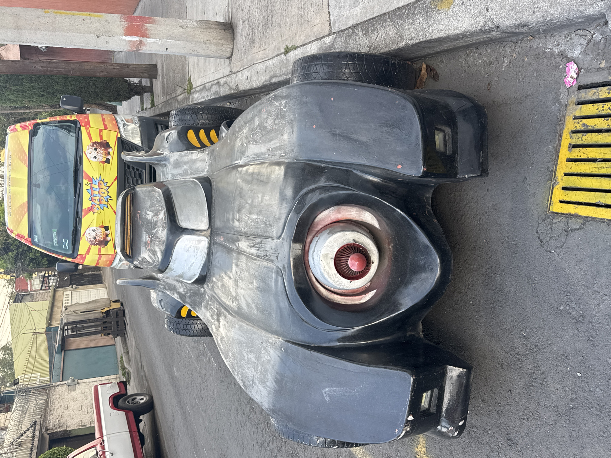 Mexico City evening captures Batman car, aircraft, street art