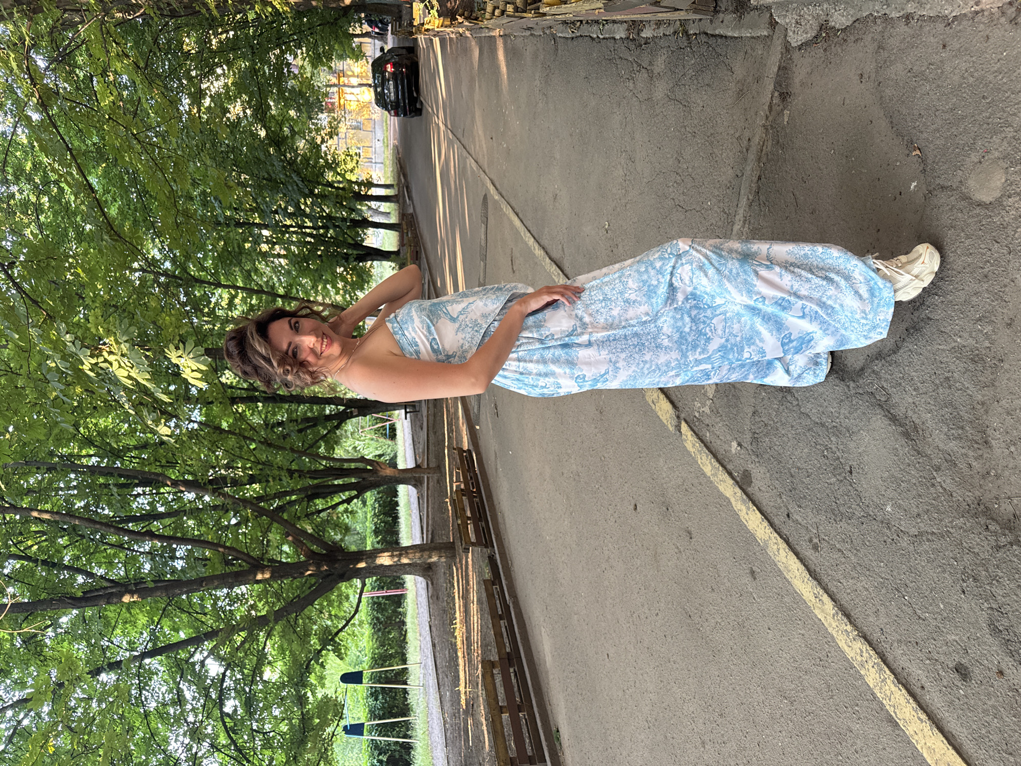 Casual outdoor portraits on a tree-lined path in Kryvyi Rih