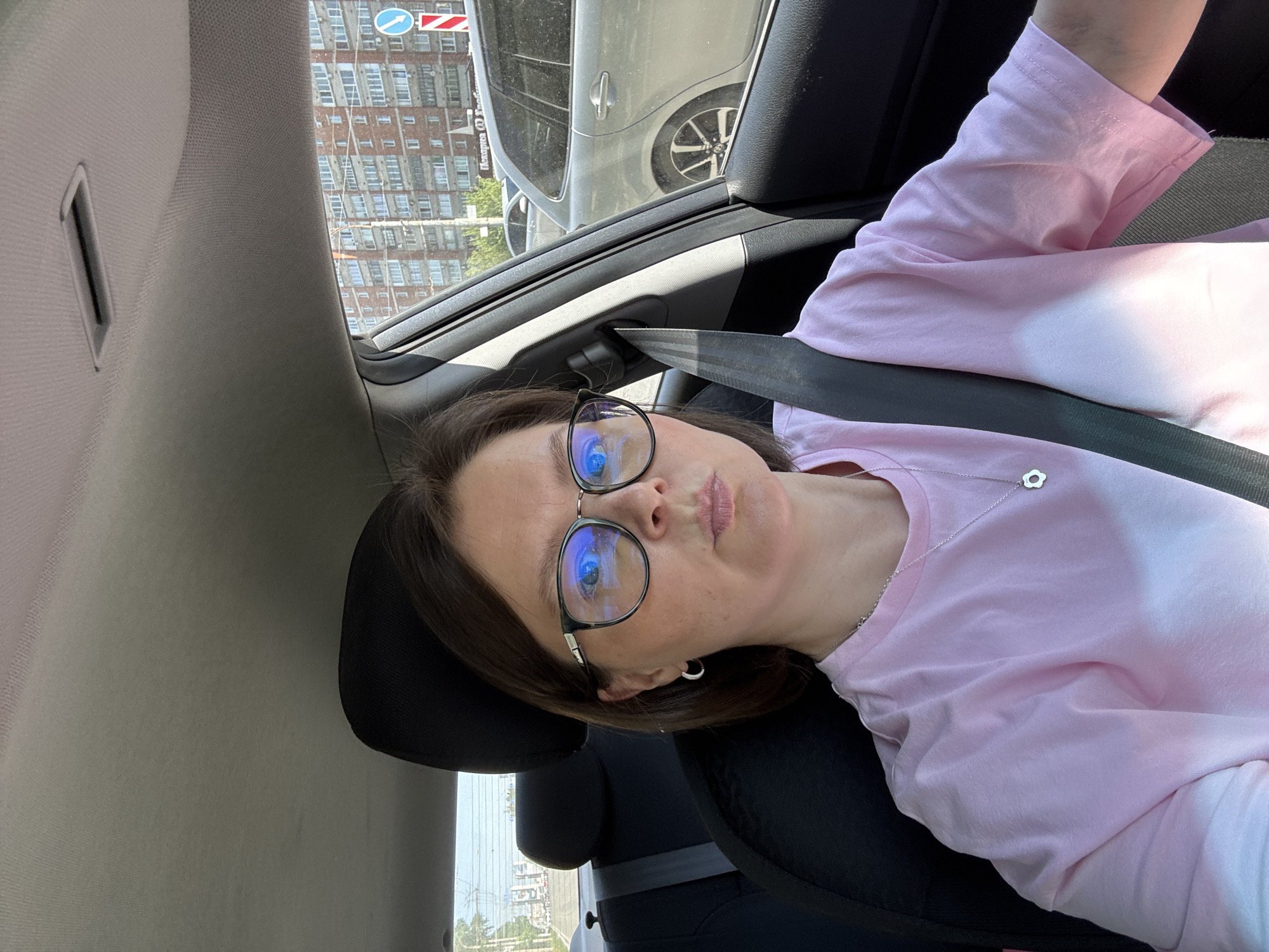 Passenger in pink shirt observed in vehicle, Izhevsk