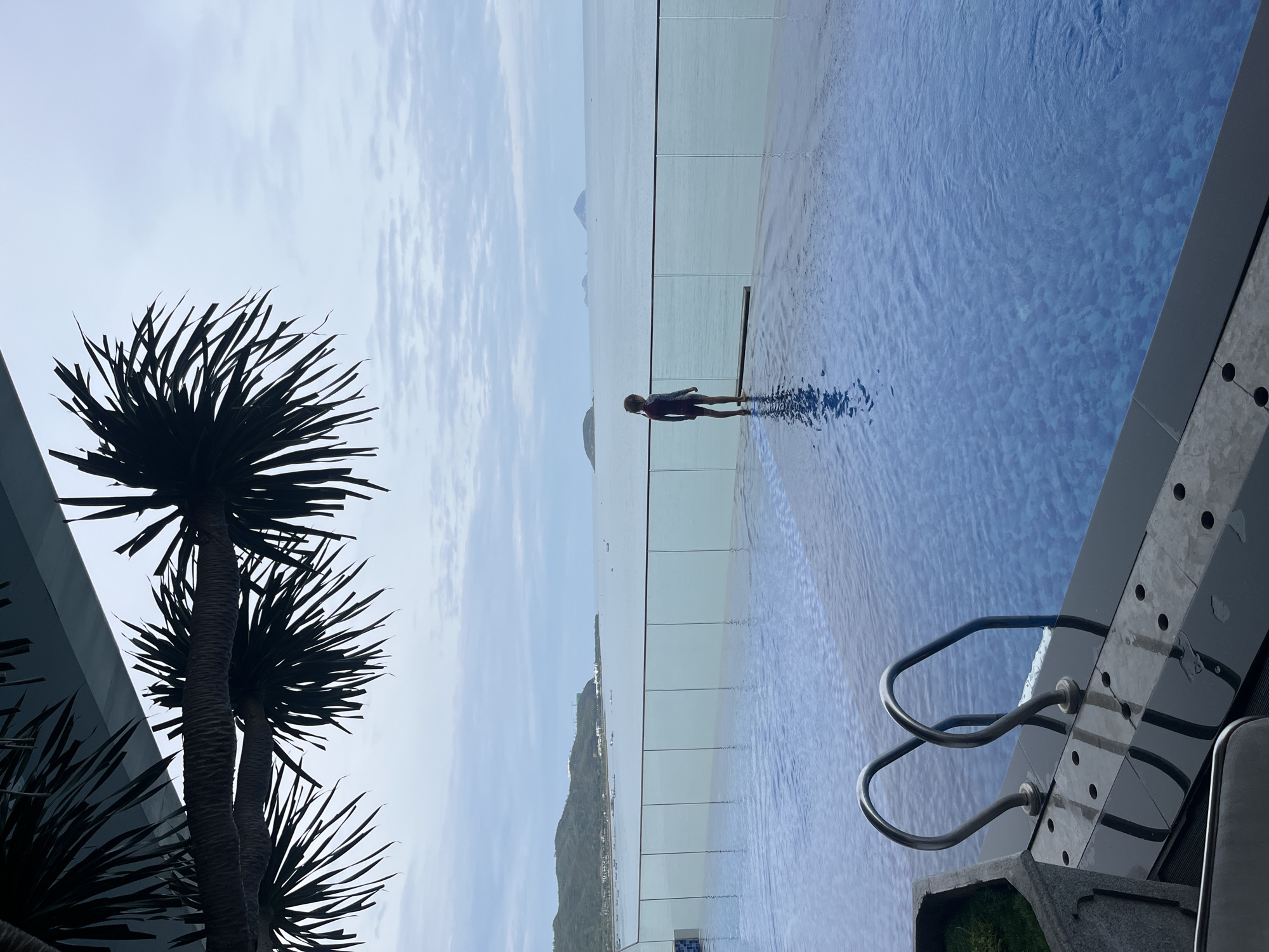 Infinity pool overlooking bay photographed at Vietnam resort