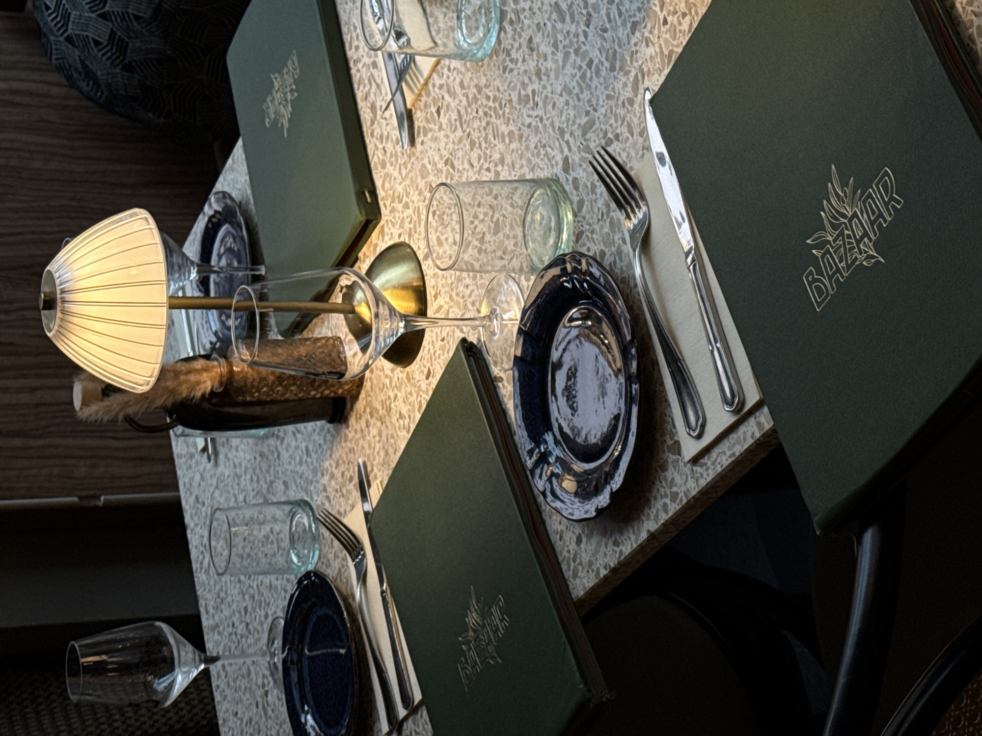 Restaurant table setting observed in Luxembourg with blue plates