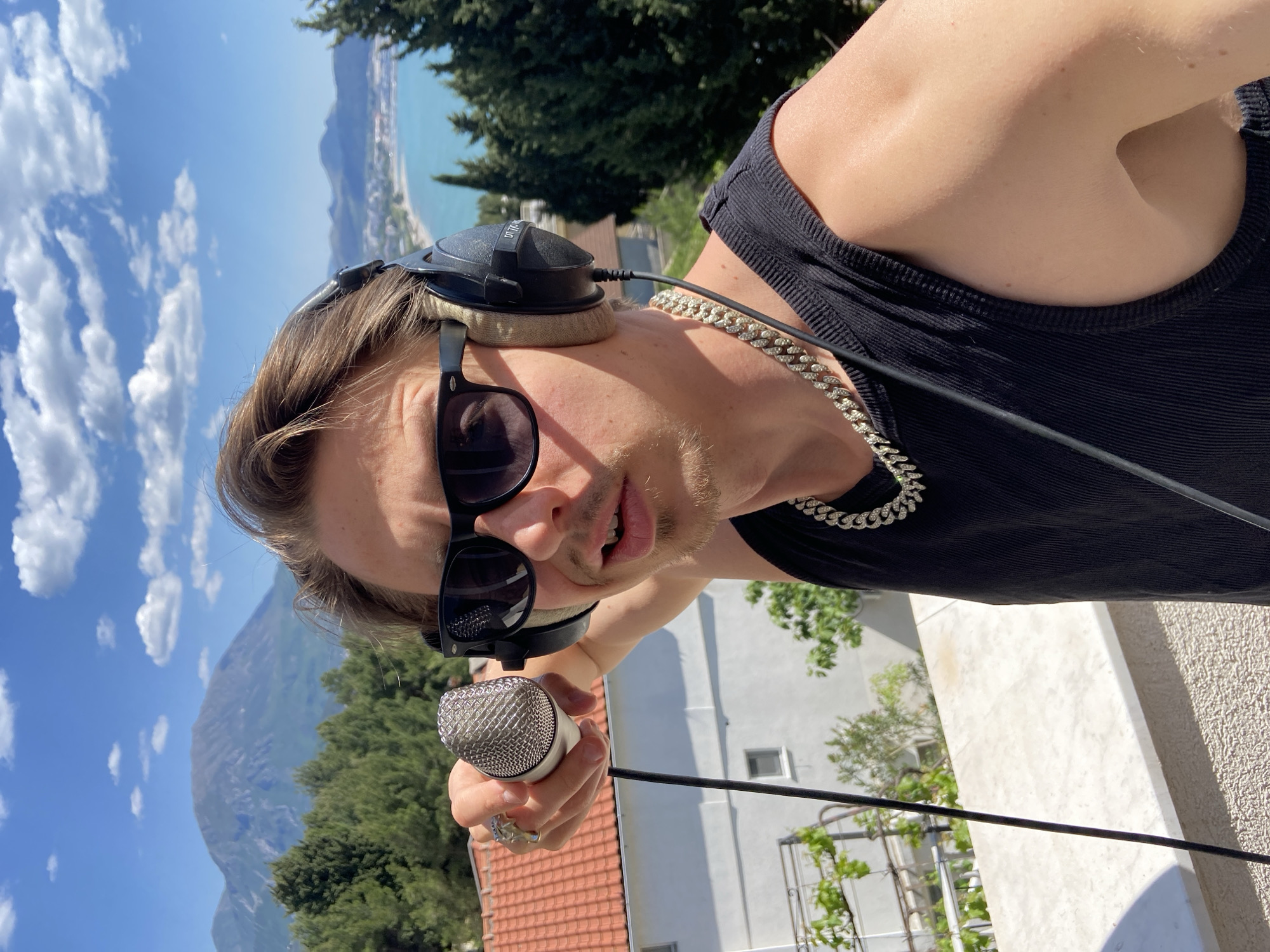 Young man poses for photos on Montenegro balcony