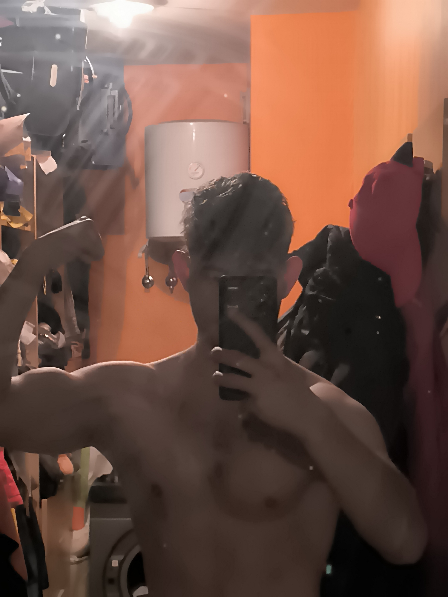 Man takes multiple mirror selfies in Sofia bathroom
