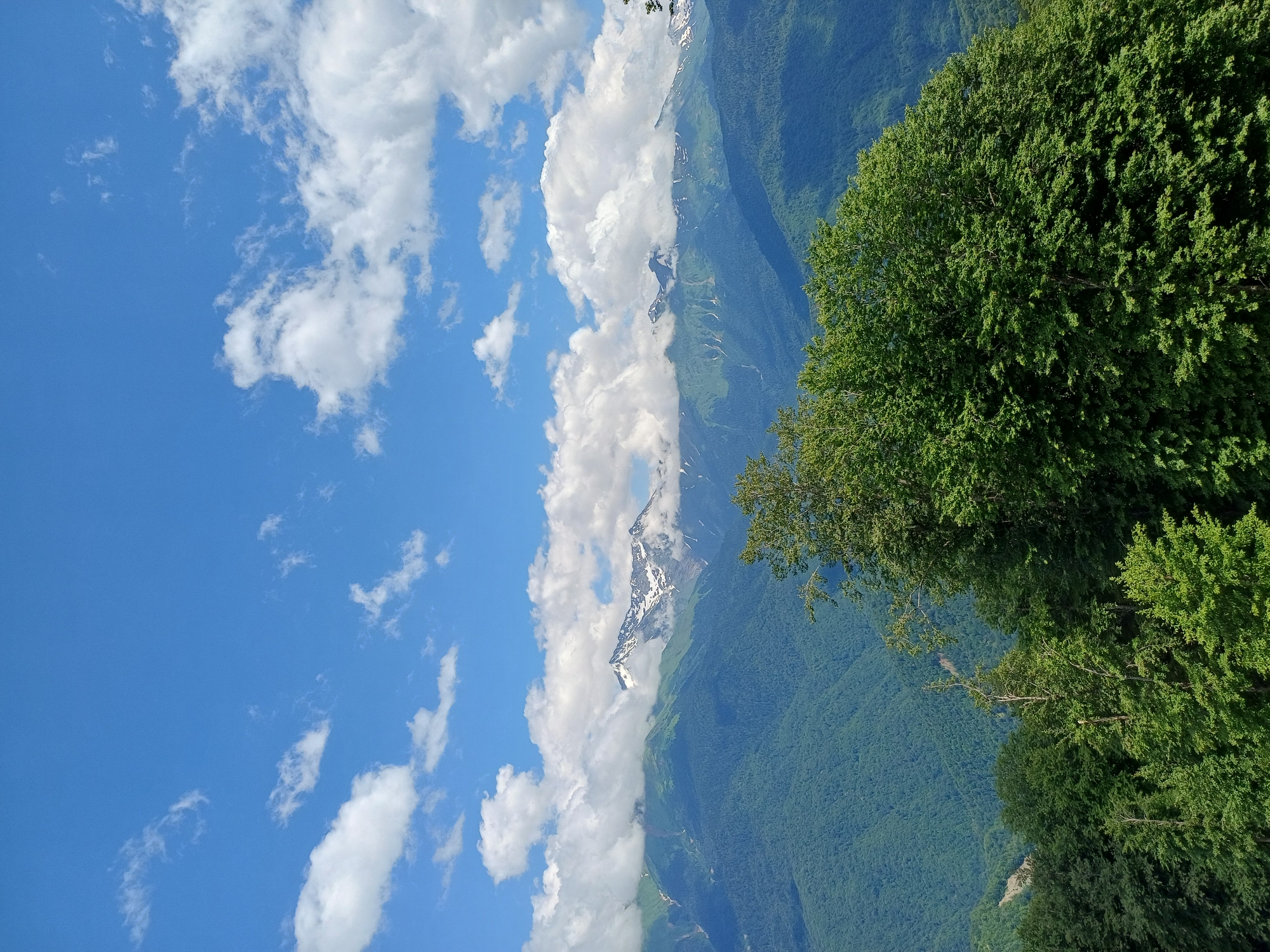 Snow-capped peaks and misty cable cars at high altitude