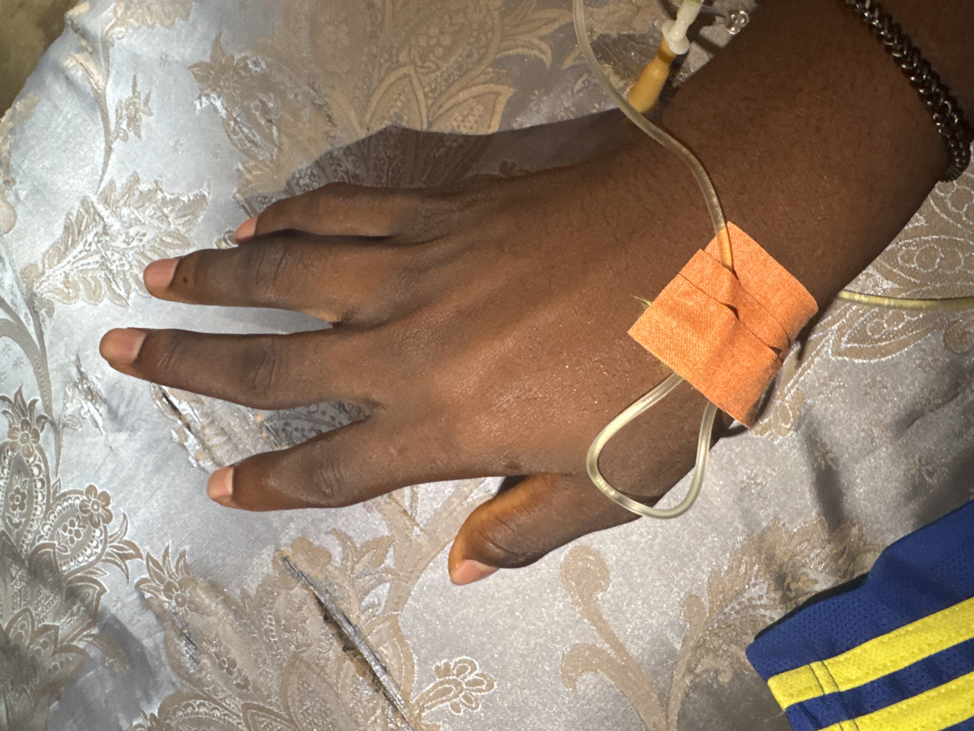 Patient receives IV treatment in Oboama, Nigeria