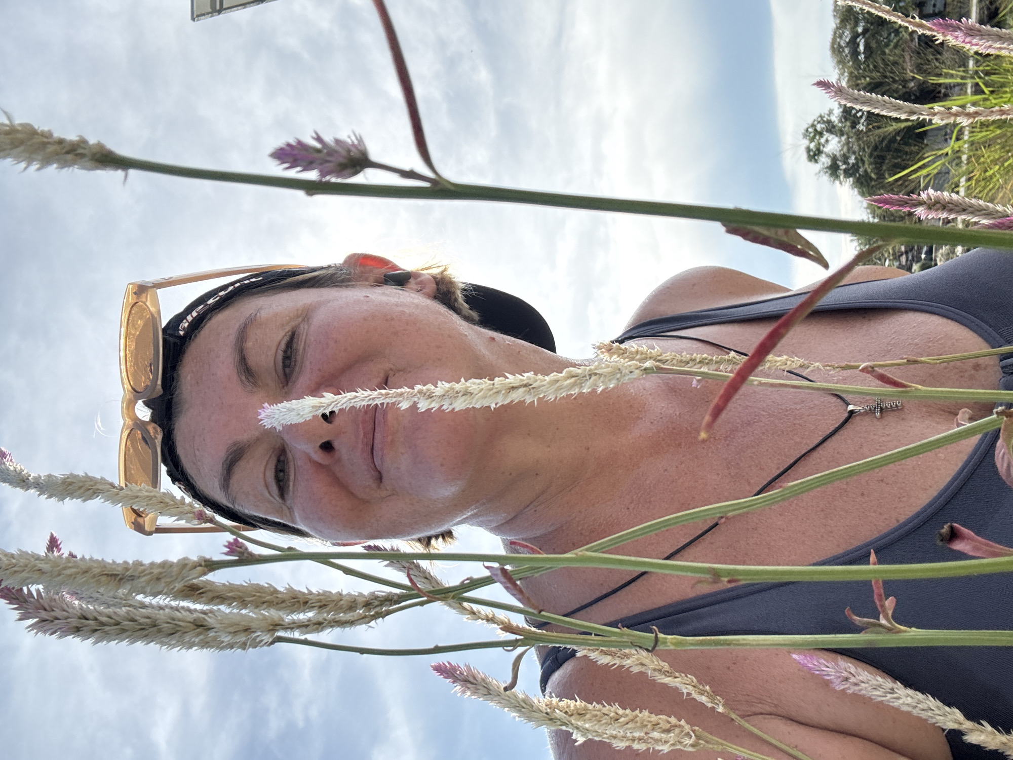 Person photographed resting in flower field in Thailand