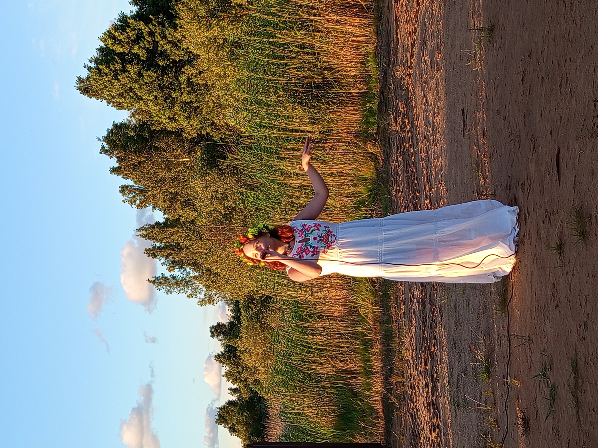 Folk holiday celebration with dancing, flowers, and live music in rural Russia