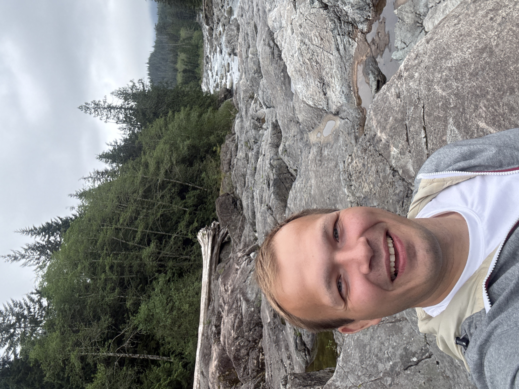 Three men photograph scenic river gorge in Long Beach