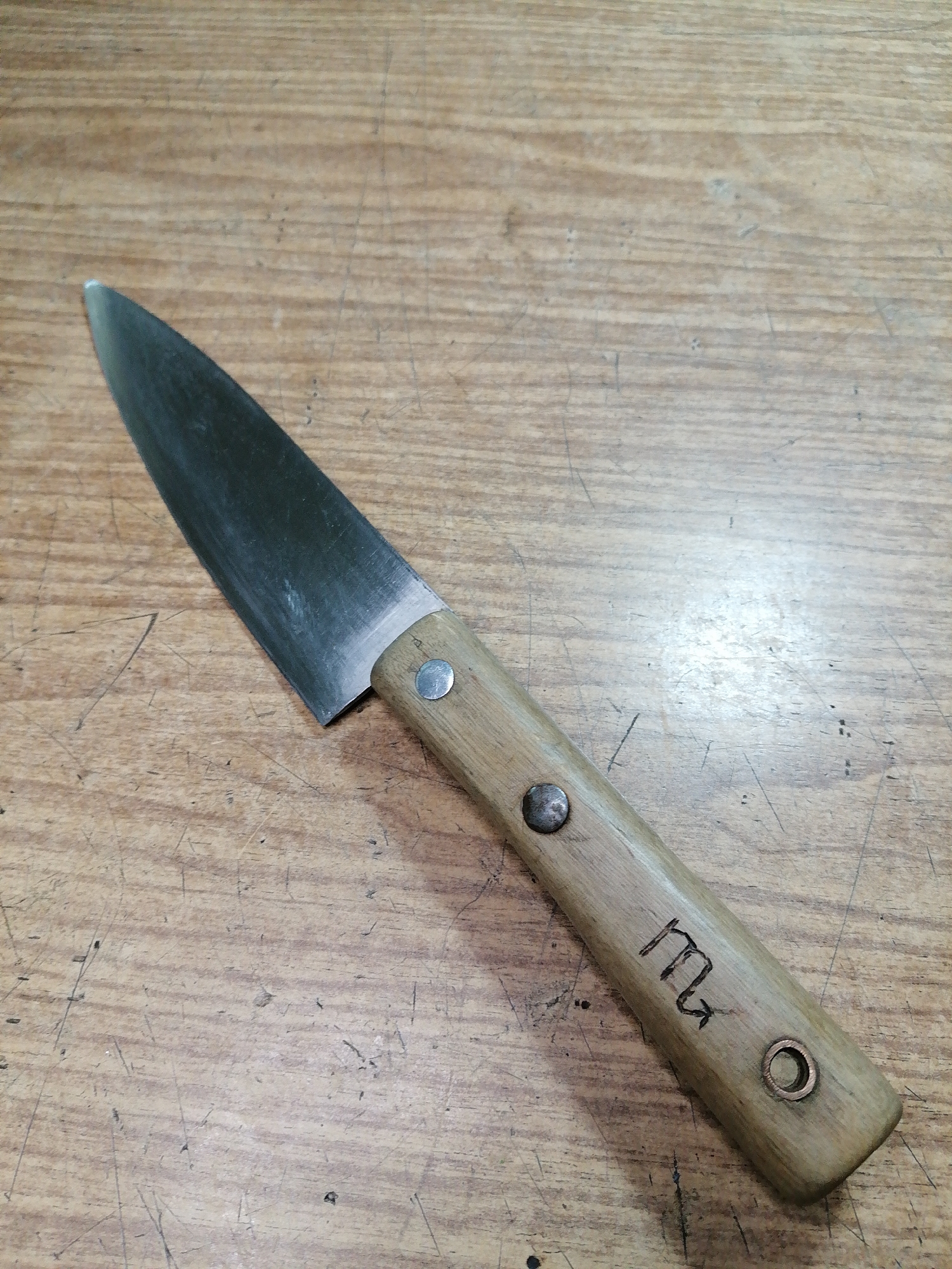 Handmade knives, amber stones, and curiosities on a Rostov workbench
