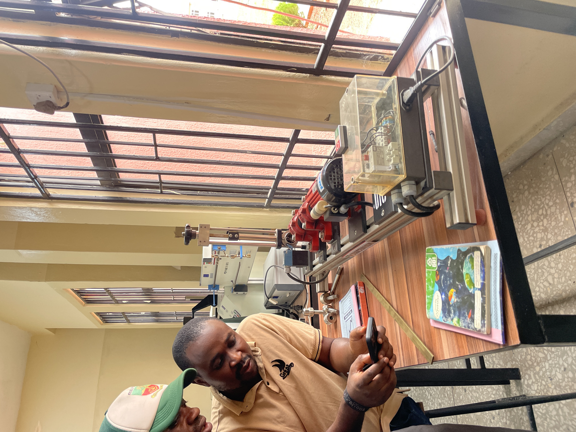 Scientific demonstration with polariscope held in Afaka classroom
