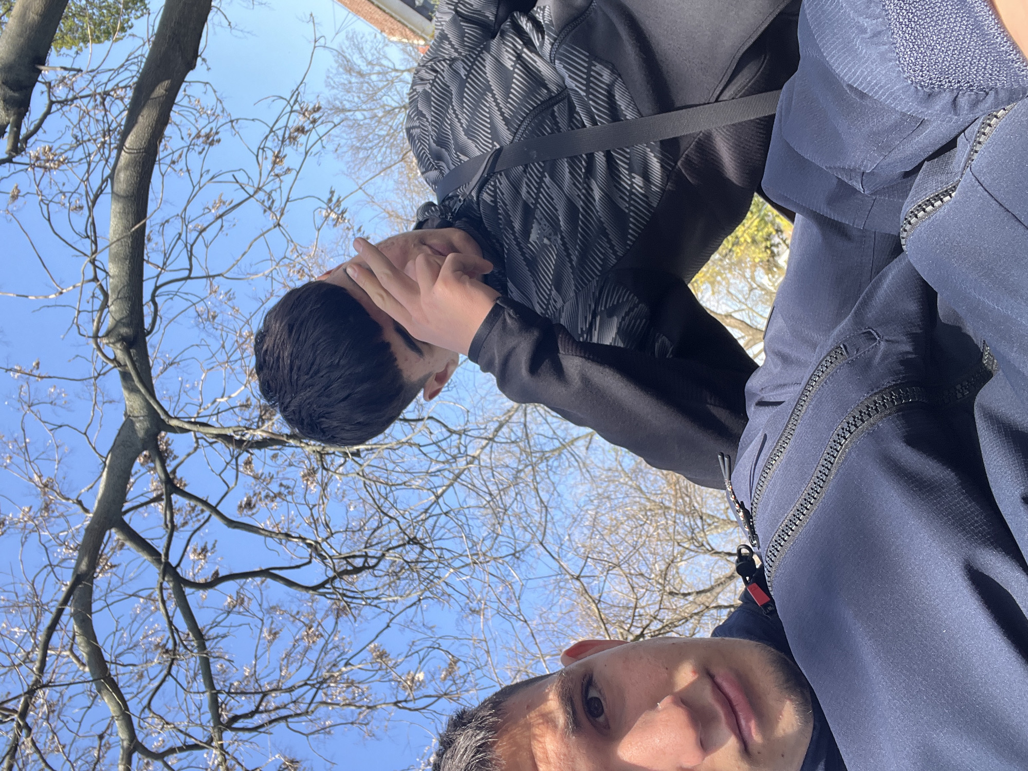 Two young men enjoy sunny afternoon in Saedinenie park