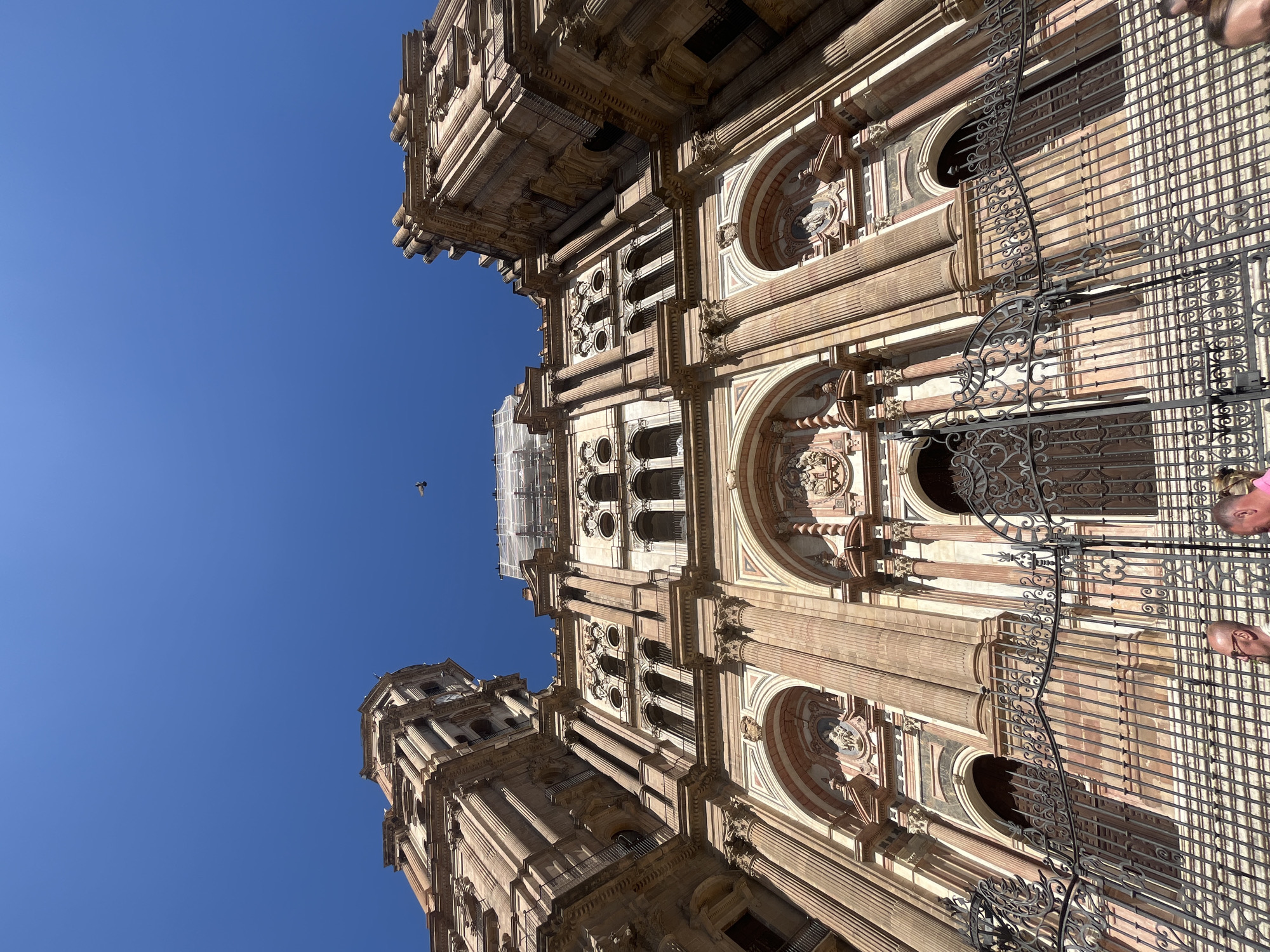Tourist documents Málaga Cathedral and city streets in Spain
