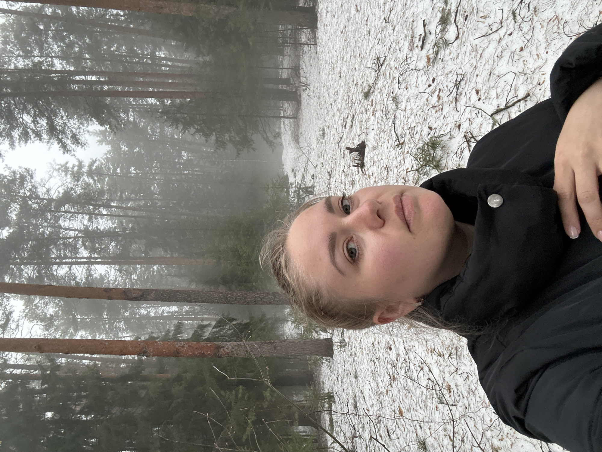 Woman's SUV stuck in snow near foggy Russian forest