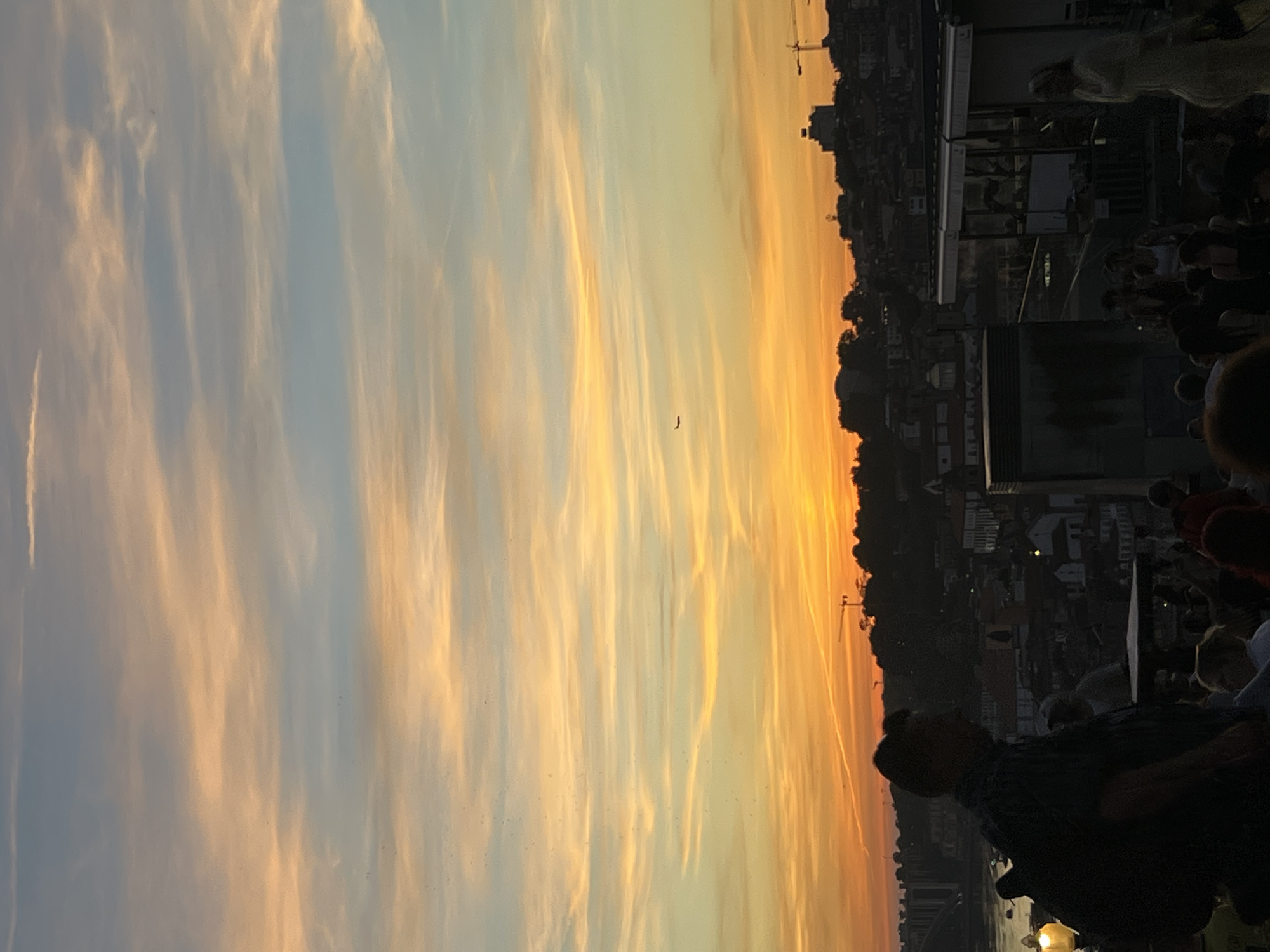Crowds gather in Vila Nova de Gaia for sunset viewing