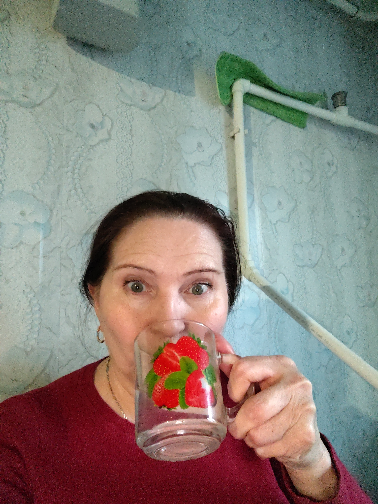 Woman documents afternoon meal and handmade crafts in Russian village