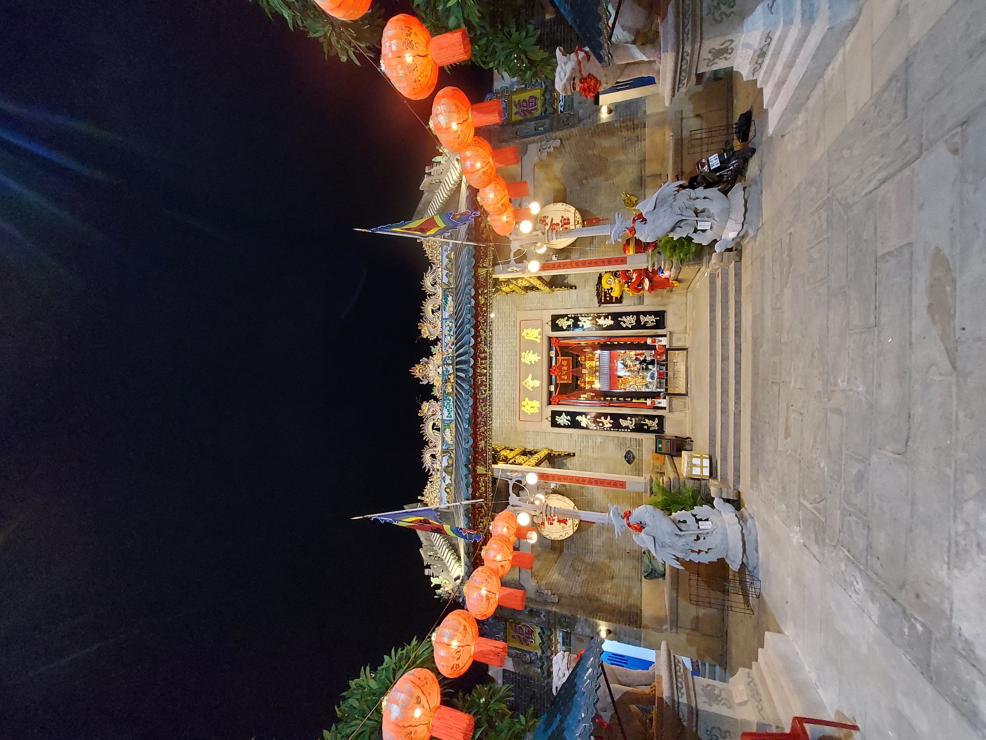 Hoi An at night: temple lanterns and grilled octopus street food