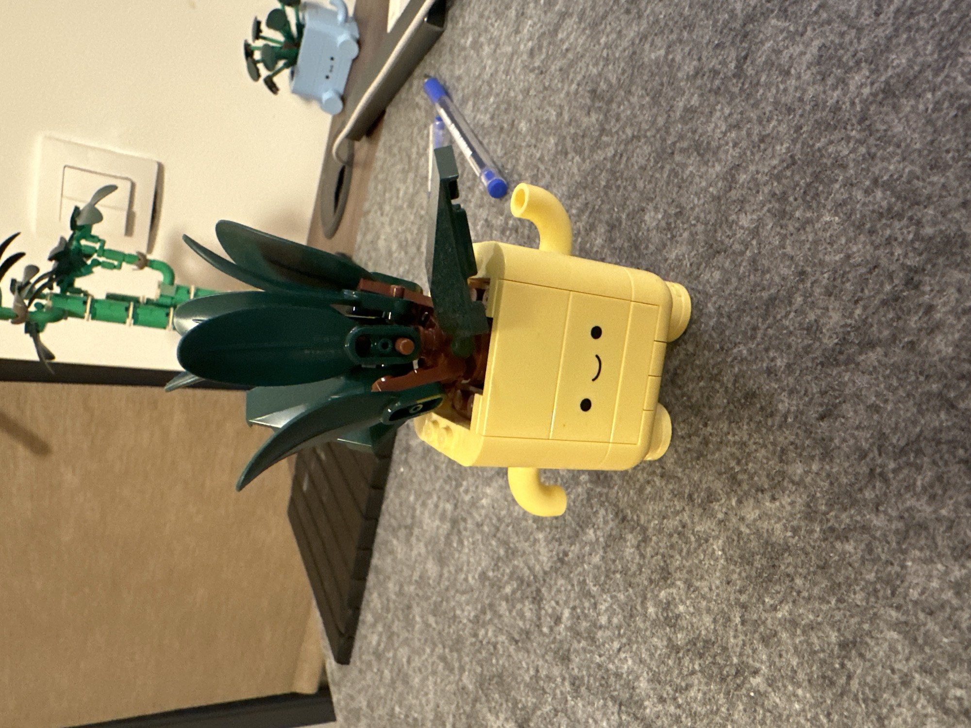Lego pineapple head spotted on gray surface in Sofia