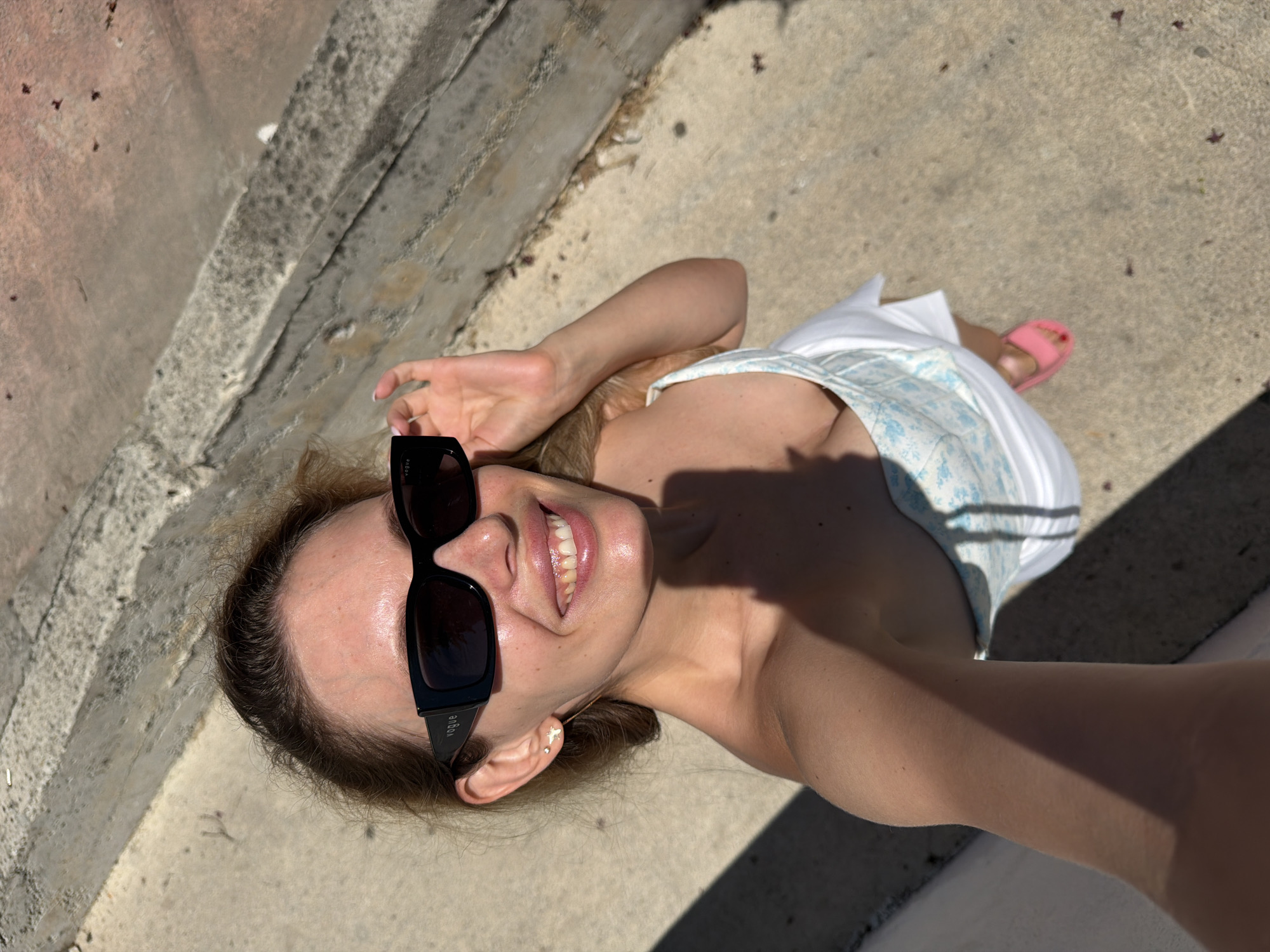 Woman documents morning activities through selfies in Budva, Montenegro