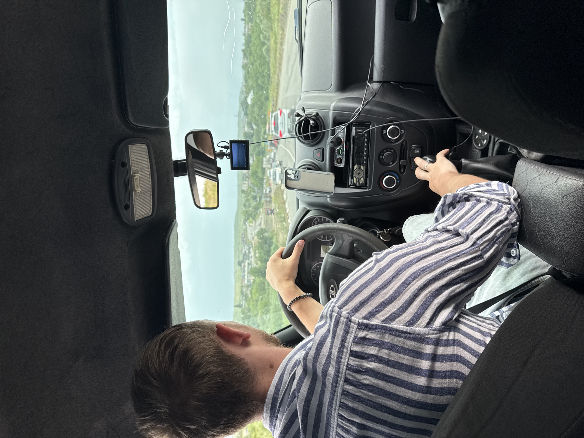 Backseat view of a driver on the road in Nadezhda