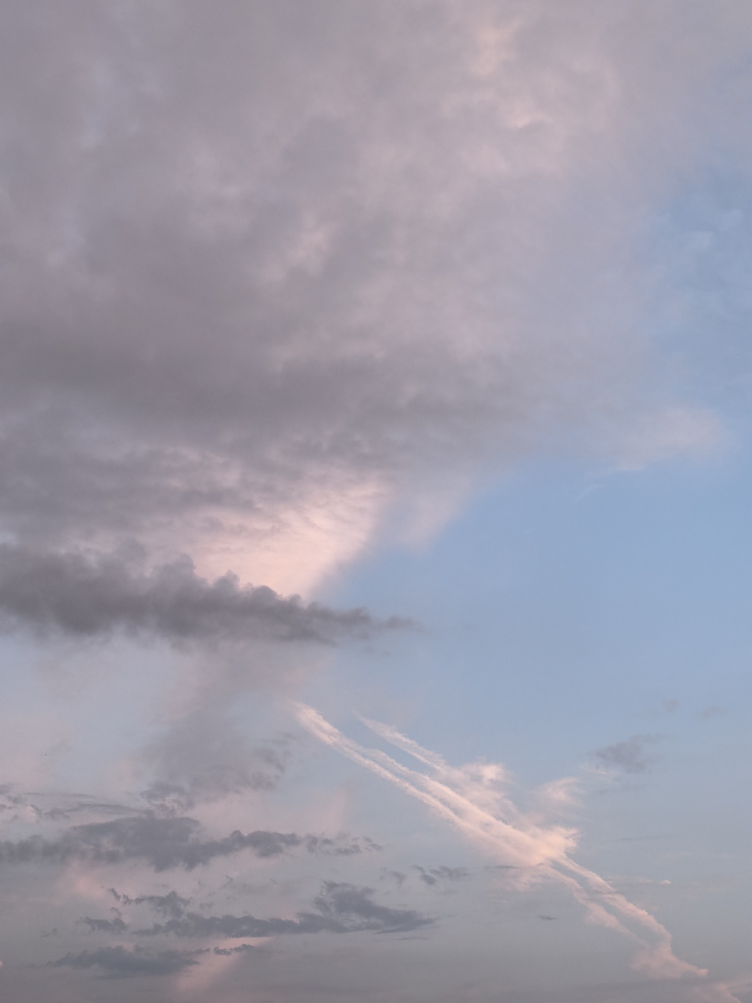 Cirrus clouds and pastel light at sunset