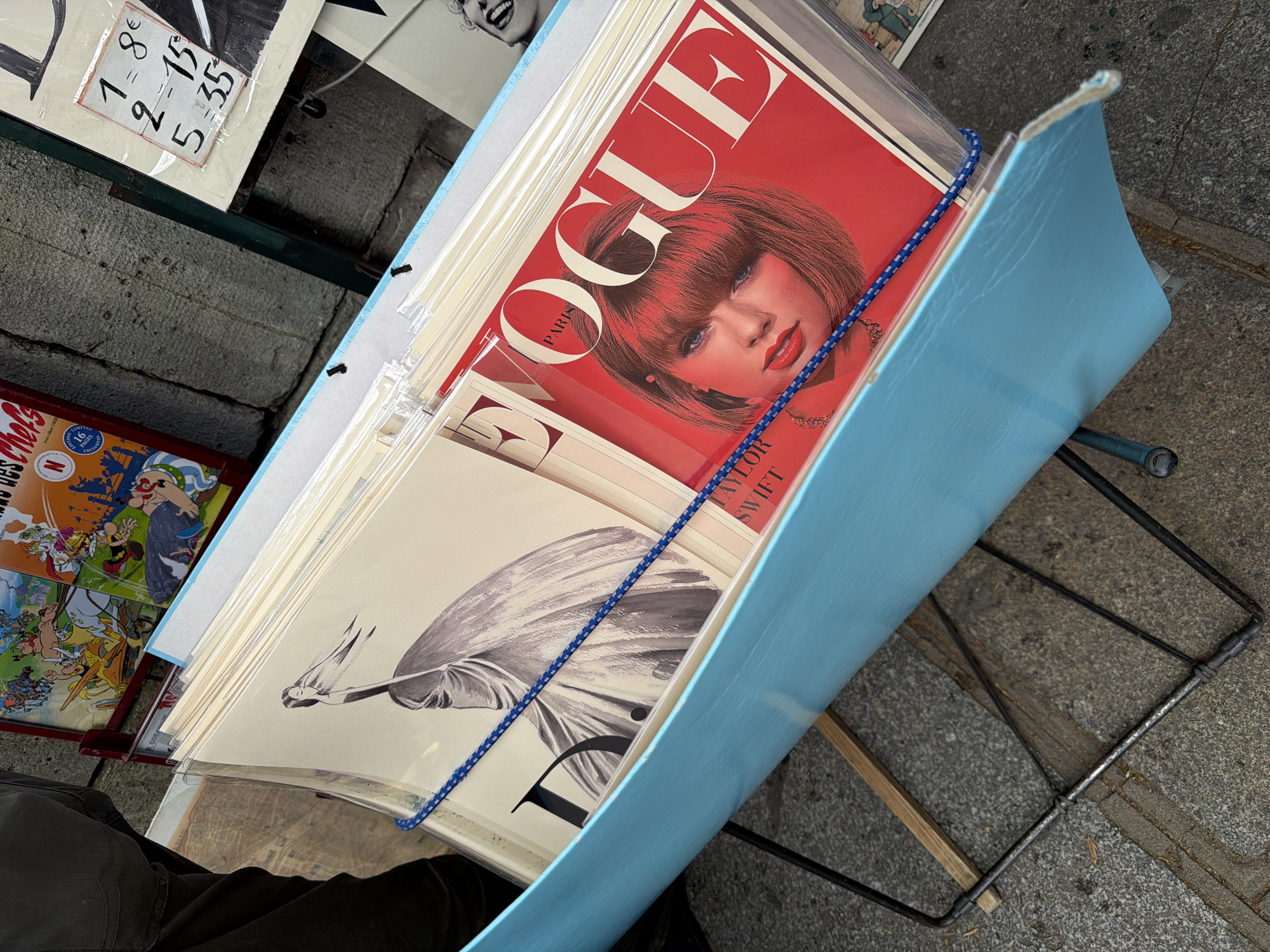 Paris vendor displays Taylor Swift Vogue covers amid spring advertising