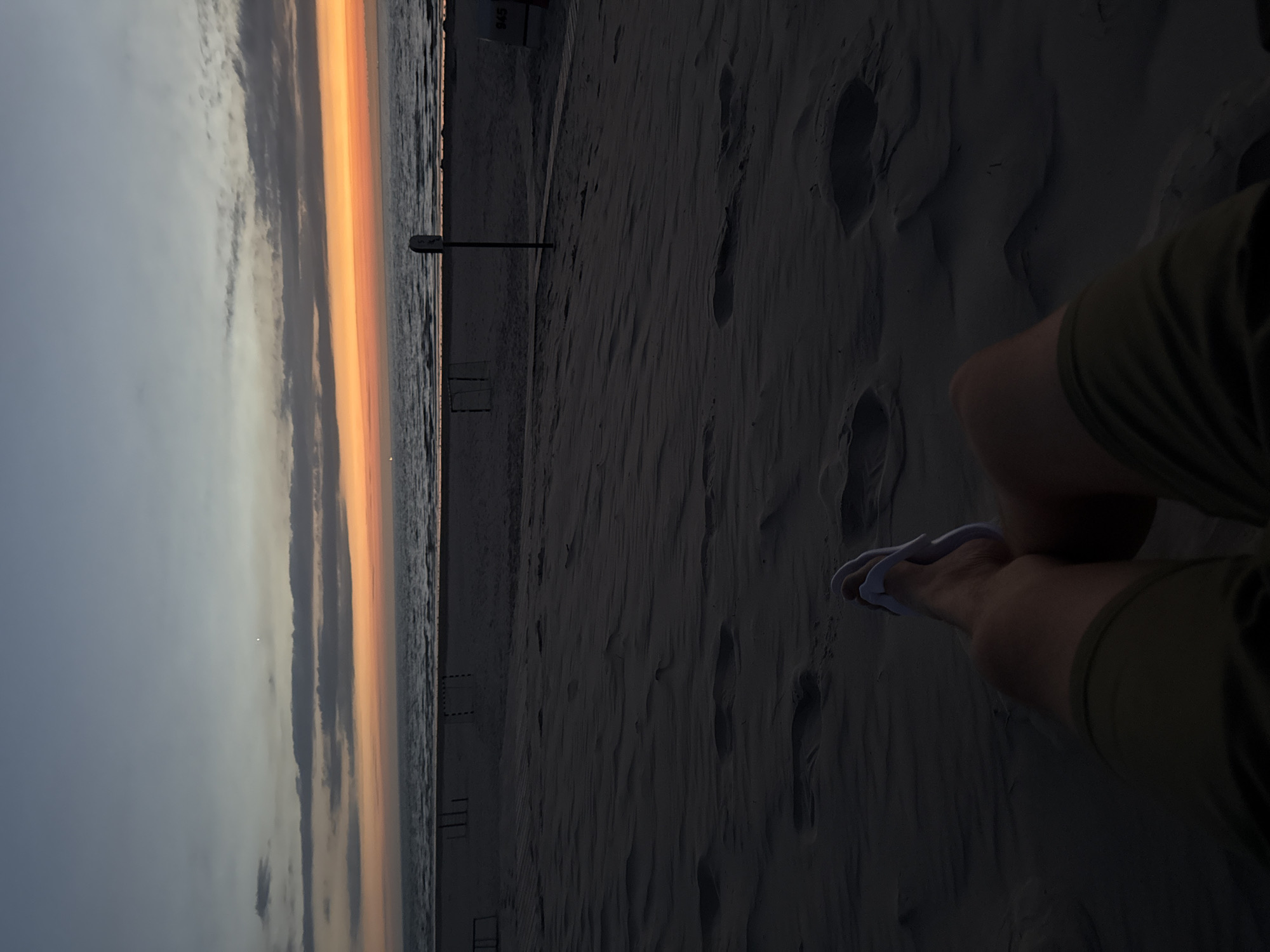 Feet in the sand, facing the North Sea on Langeoog