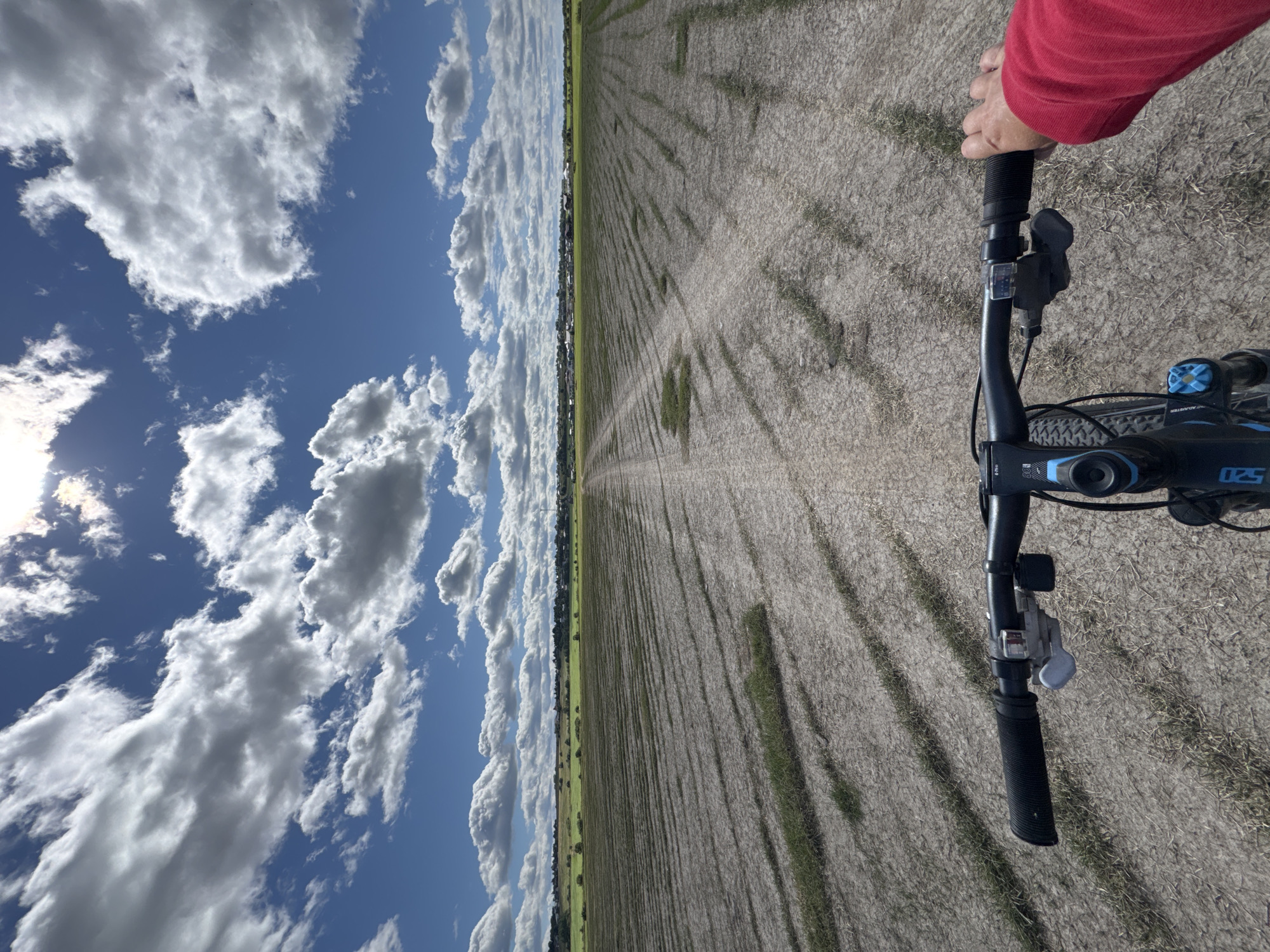 Bike ride through Kempelevo's farmland fields on a summer morning