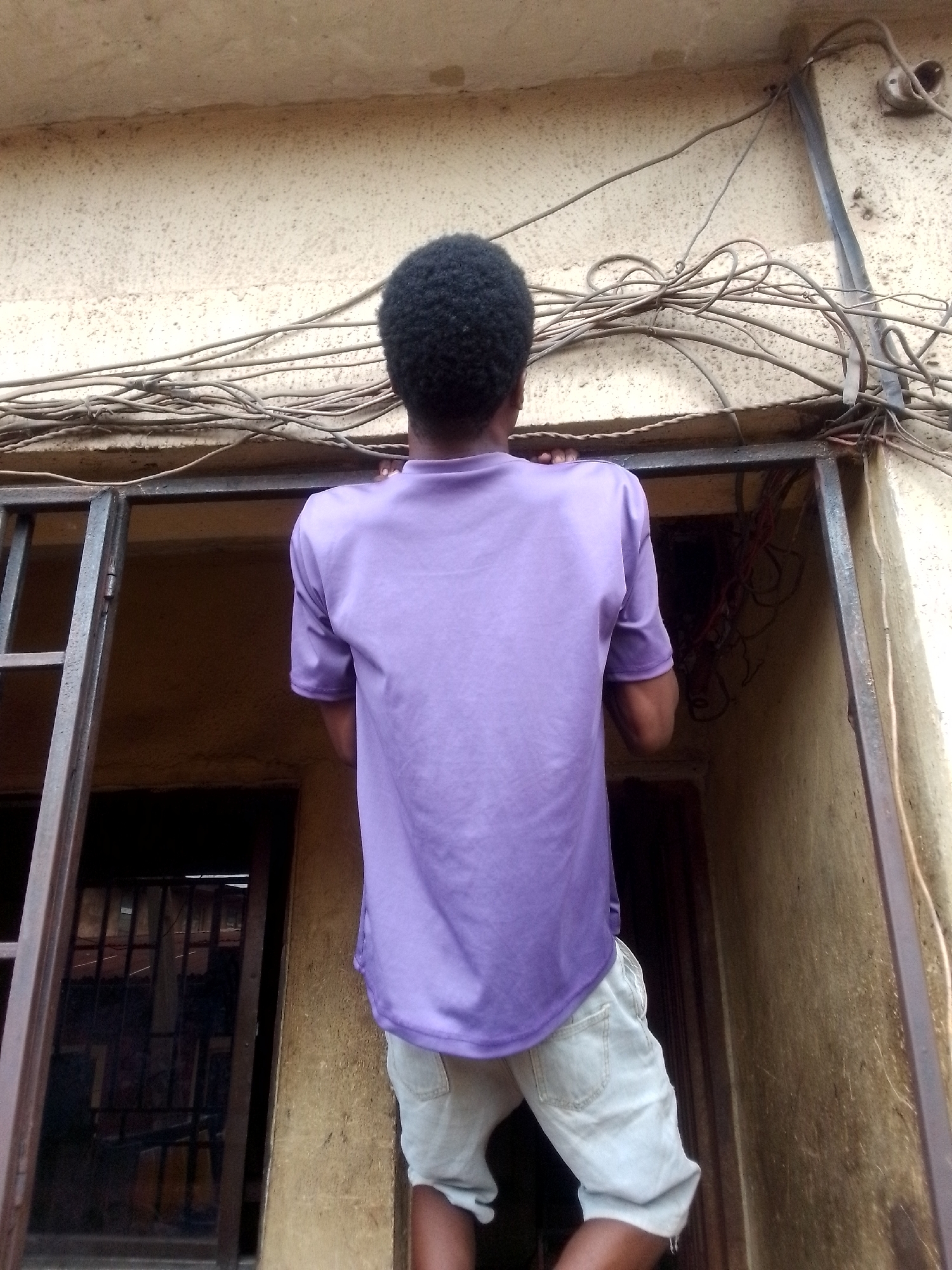 Morning street life documented in unidentified urban community