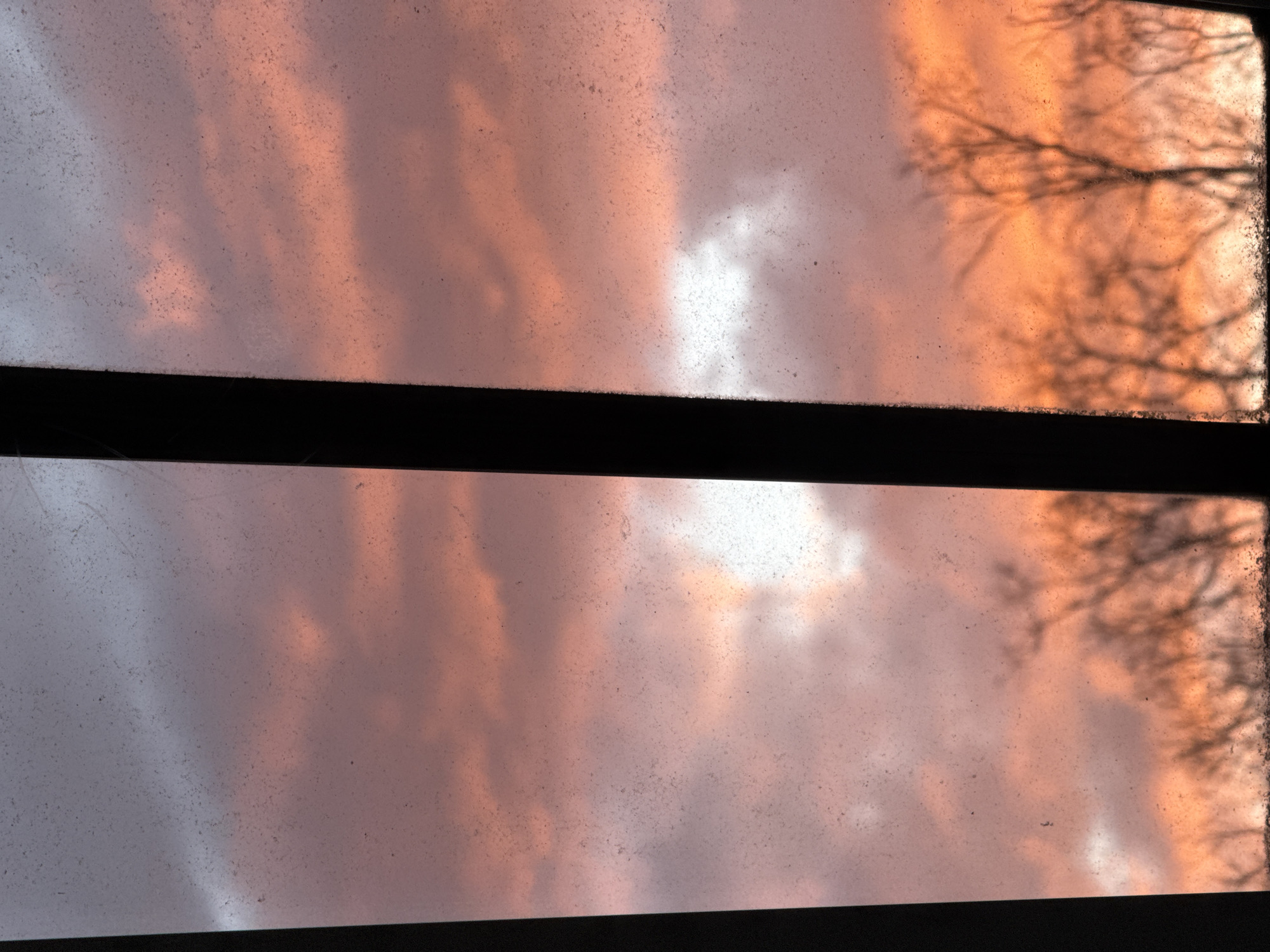 Sunset viewed through wooden window in London