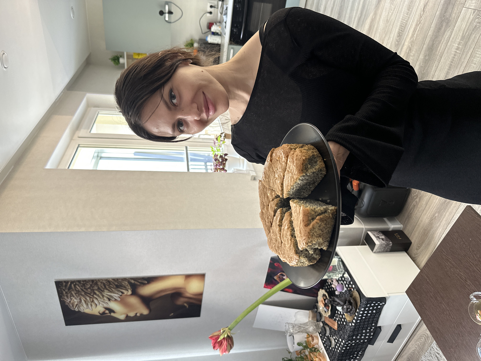 Woman enjoys homemade cake in Murino residential setting