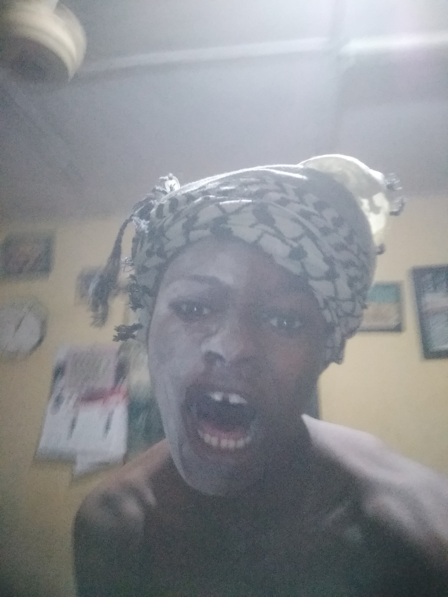 Person applies face mask in Shangisha home