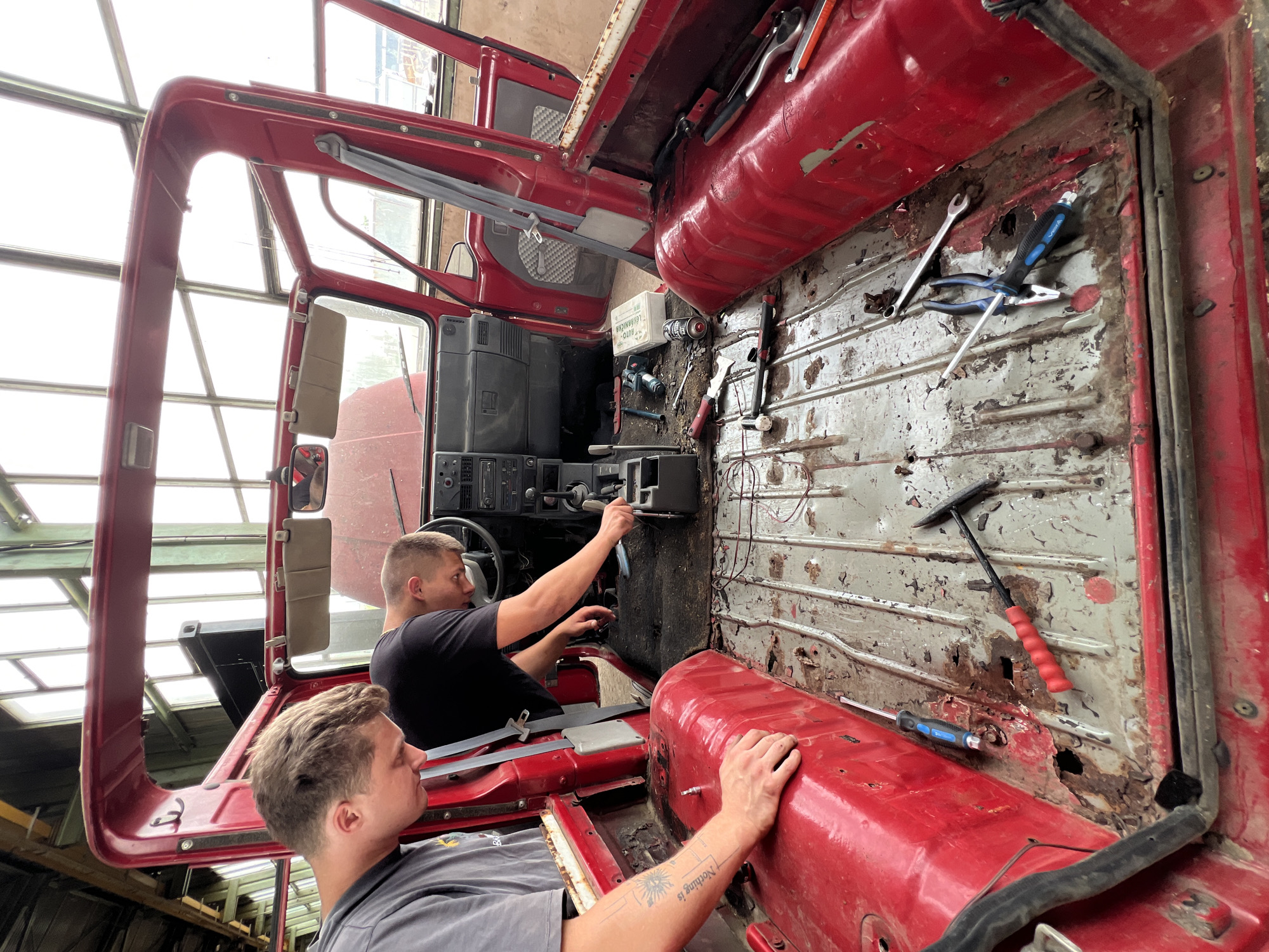 Red Jeep Wrangler under repair in Lanžhot industrial workshop
