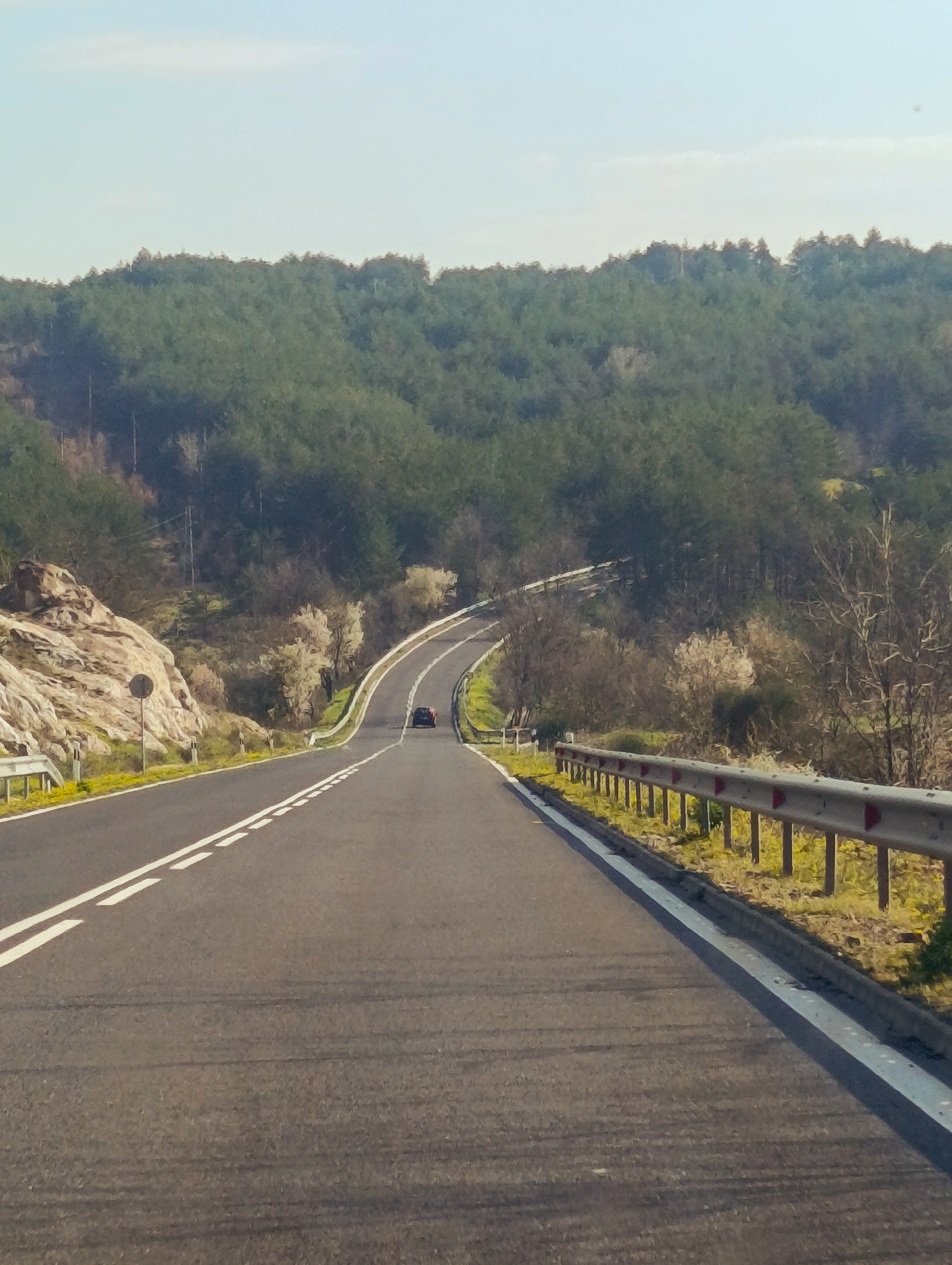 Vehicle travels rural road near Sedlovina, Bulgaria