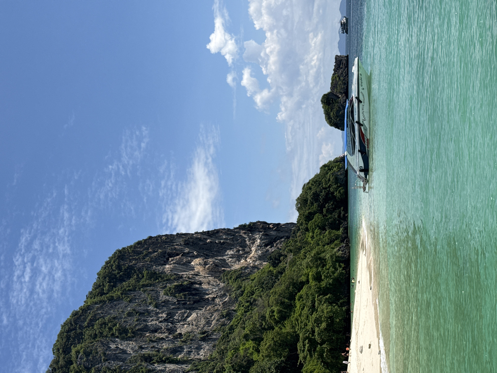 Limestone cliff meets white sand beach in Ao Nang