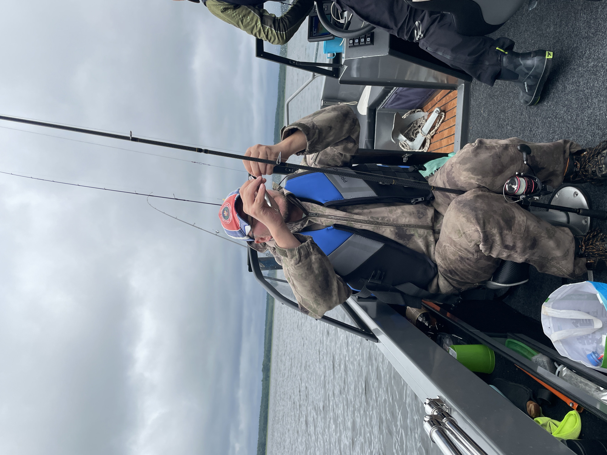 Fishing on a cloudy lake in Yablonovka, Russia